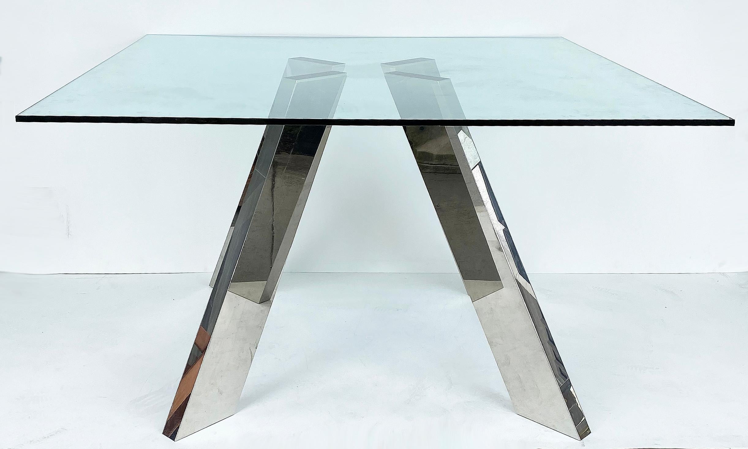 Modernist stainless steel and glass top table with splayed angular legs

Offered for sale is a modernist stainless steel and glass dining table with four individual angular legs that are splayed and support an affixed glass top that is .5