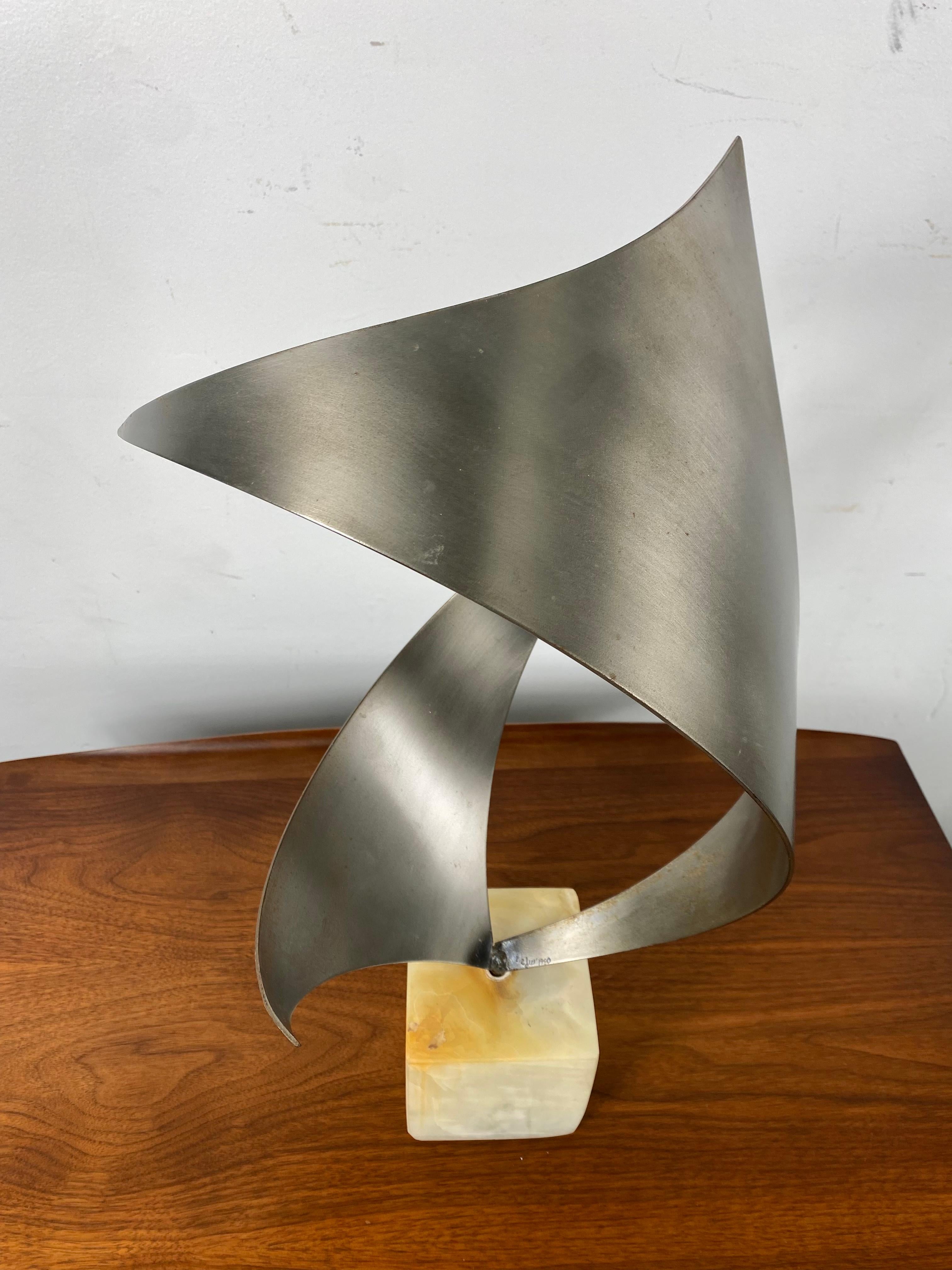 Modernist stainless steel and marble abstract table sculpture by C.Jere c.1980 Looks amazing from any angle, Signed and dated.