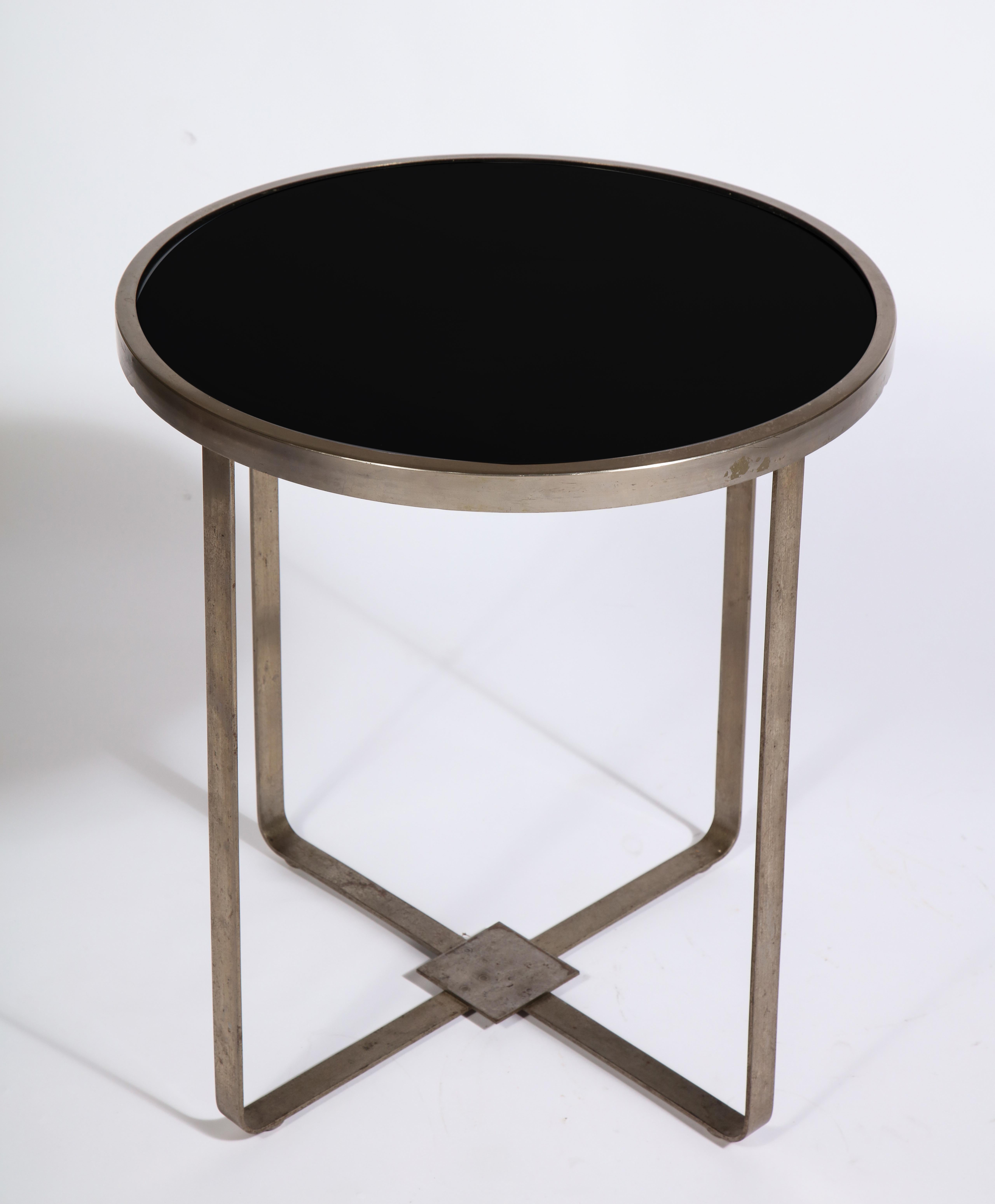 Modernist steel round black glass table, France, 1930s

Purchased with Jacques Adnet Chairs and attributed to him, but not documented.
Beautiful steel with black opaline glass. Chic and modern.