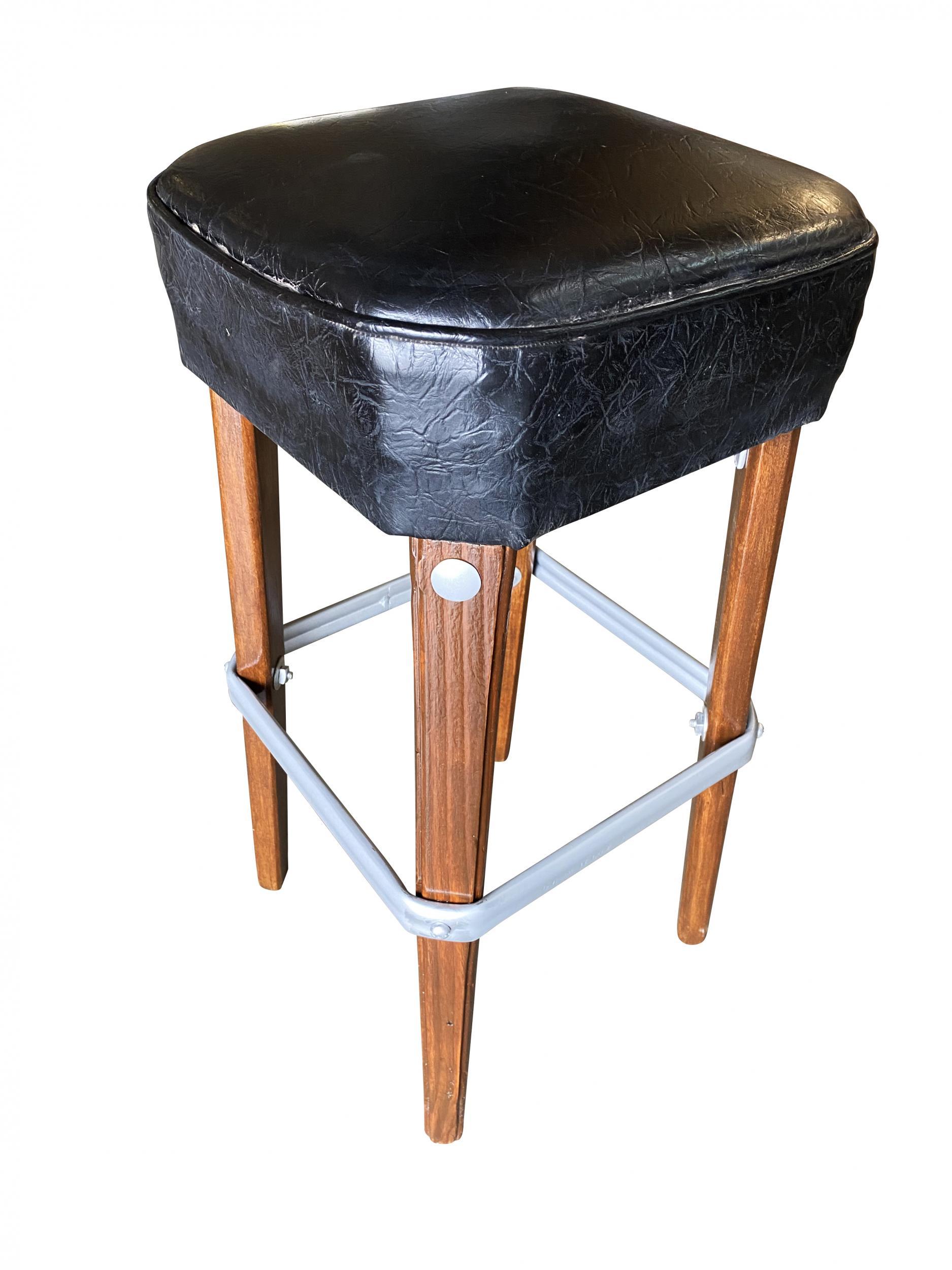 Pair of original 1970s modernist steel studded knife Leg bar stools. Each bar stool comes with a steel foot rest and black Naugahyde seat covers.

Sold as a set of 2.

 