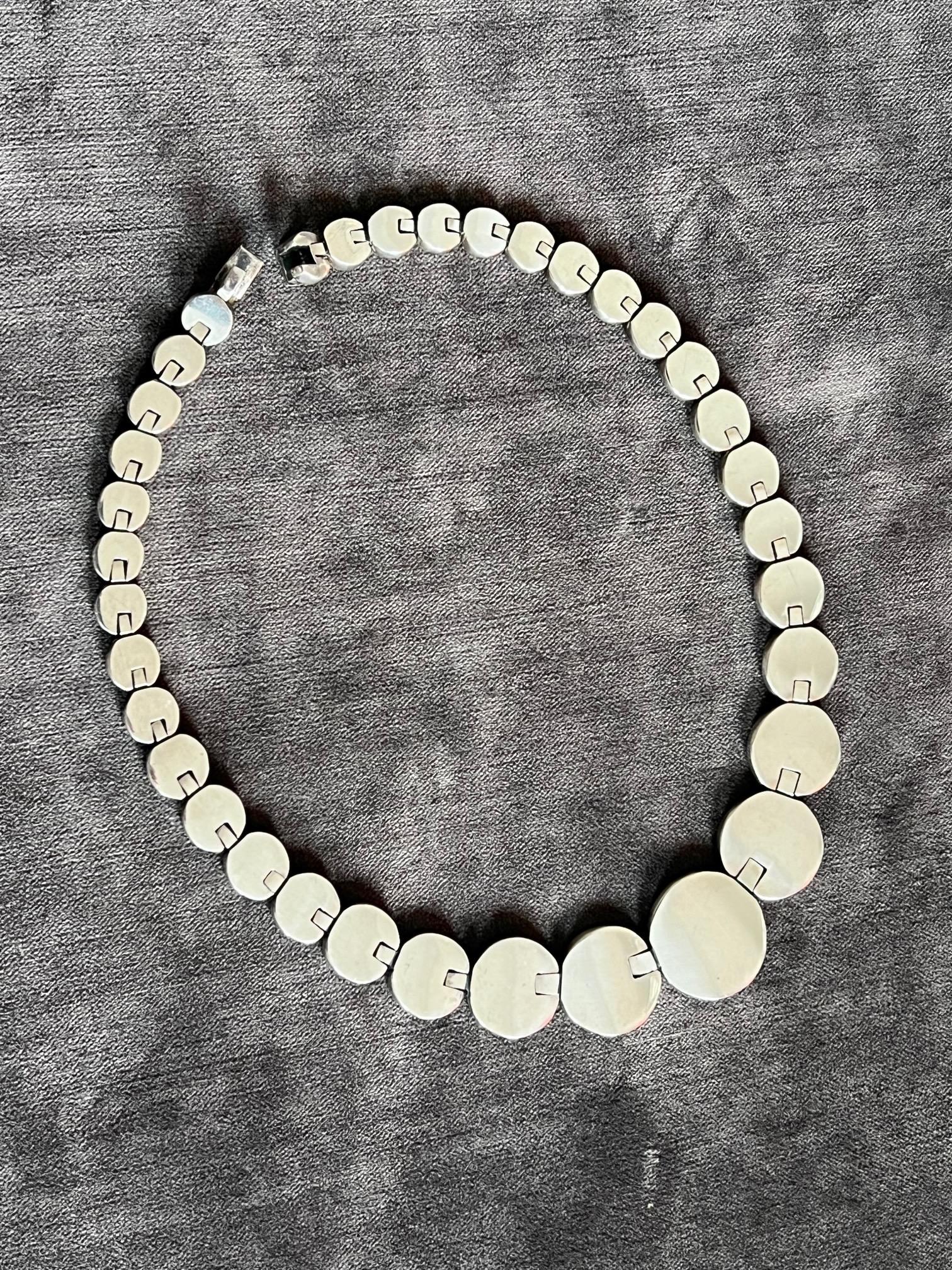 A beautiful modernist necklace-heavy and made of solid sterling in Mexico. Weighs 143 grams or 5.05 ounces and measures approx. 16.5