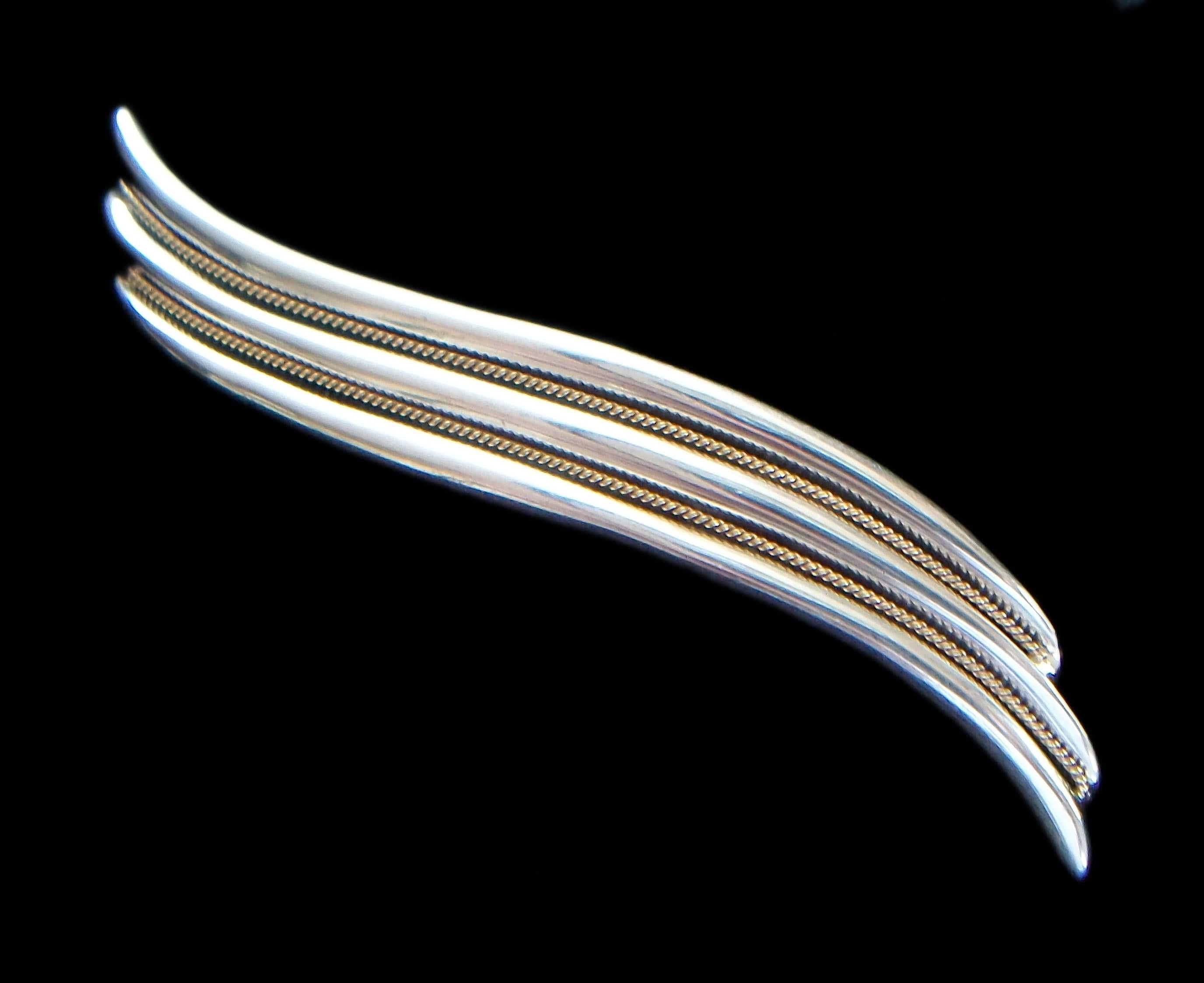 Modernist sterling silver & 18K yellow gold wave brooch - sculptural undulating form - gold rope details - crown maker's mark on the back (unknown/unidentified) as well as 'STERLING' and '18K' - country of origin unknown - mid 20th