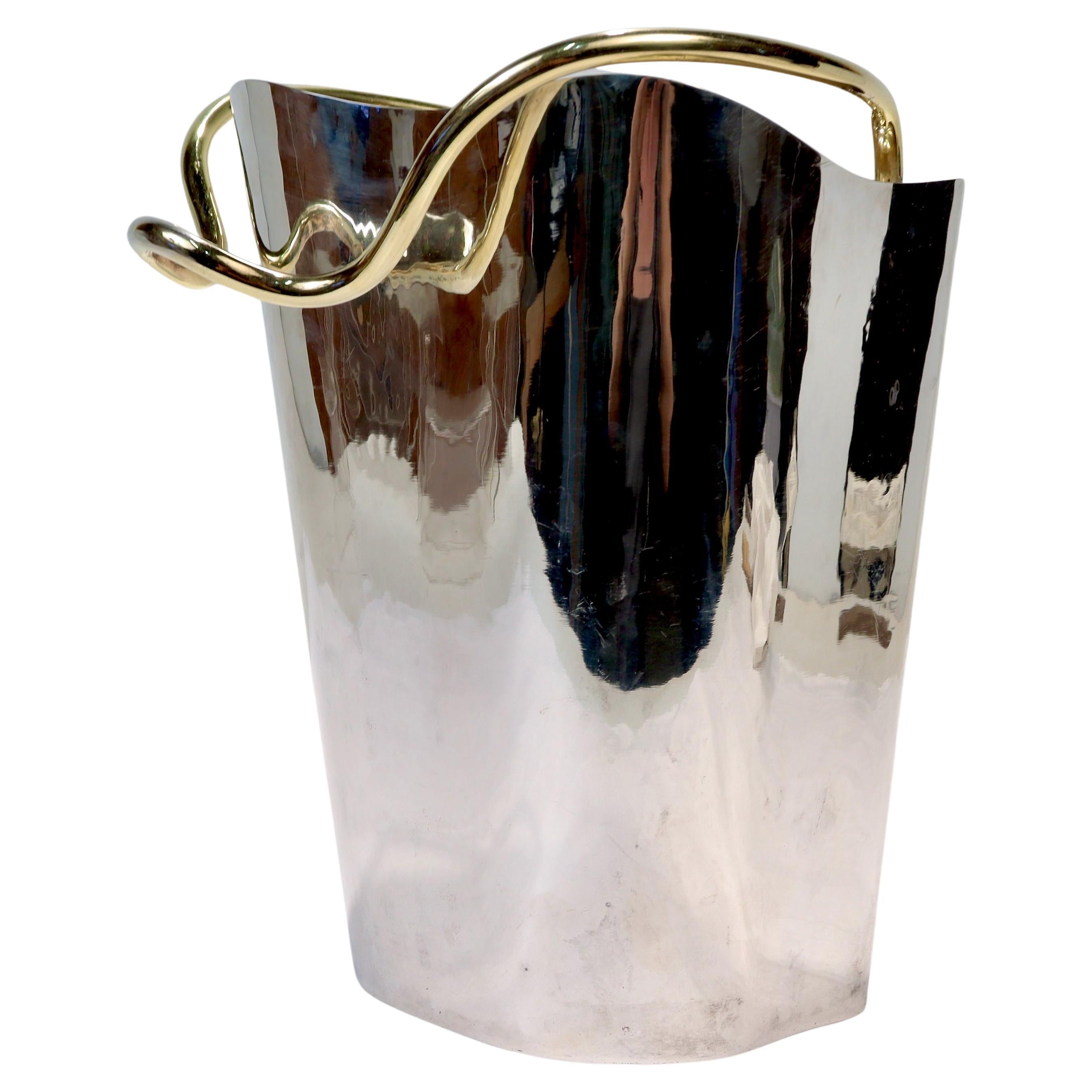 A wonderful Italian Modernist sterling silver champagne or ice bucket.

By Borek Sipek for Cleto Munari.

From the '99 Works' Series.

With a sleek hand-hammered sterling silver body along with a gold-plated handle & pill-shaped device to the front.