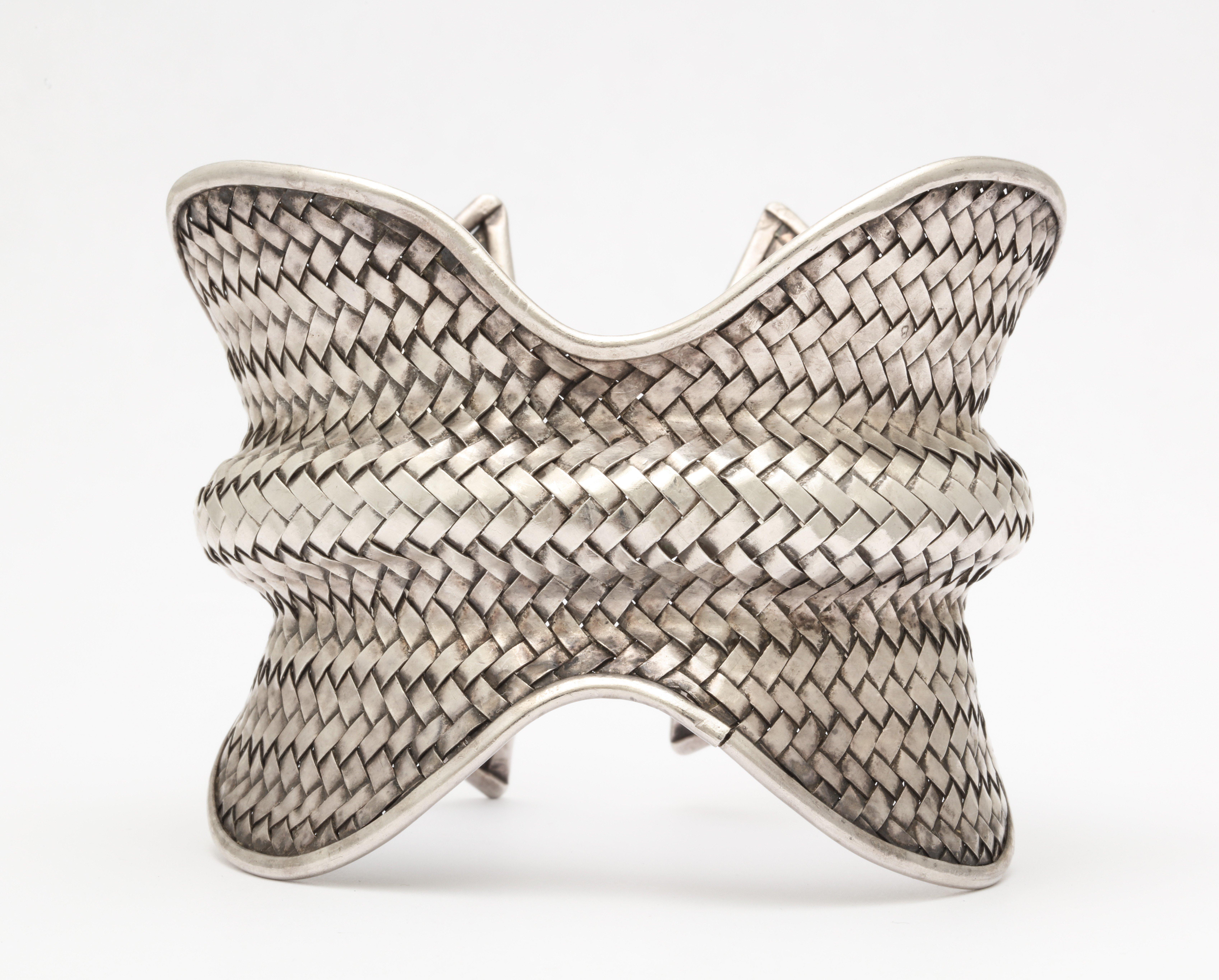 A fabulous designer woven modernist sterling silver cuff with great curves
