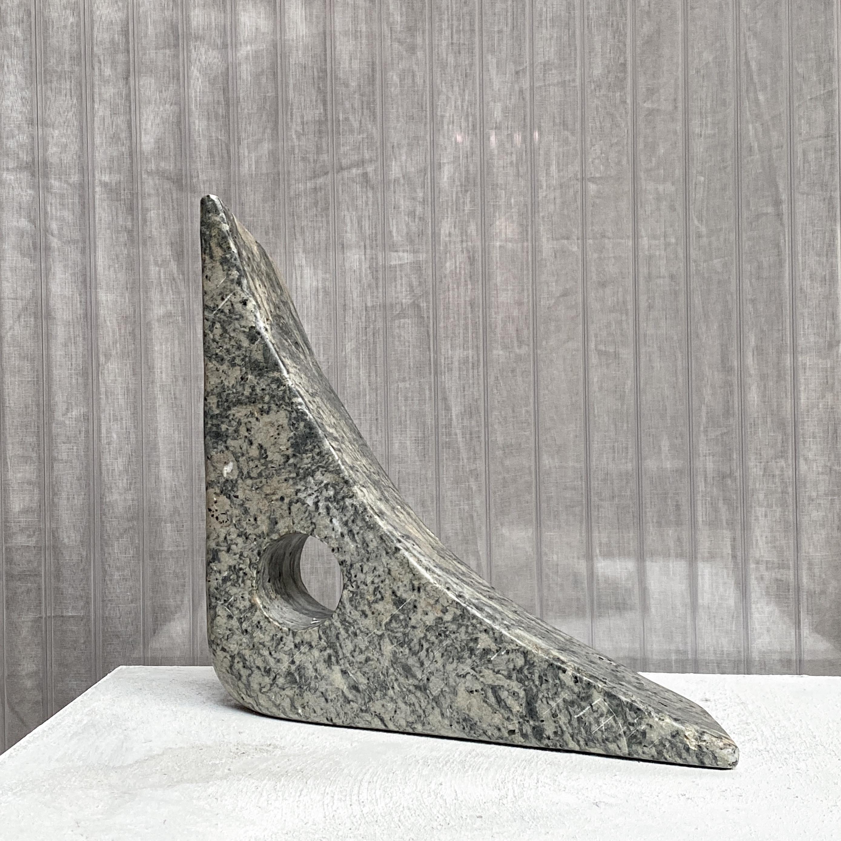 an abstract sculpture in the form of a triangle