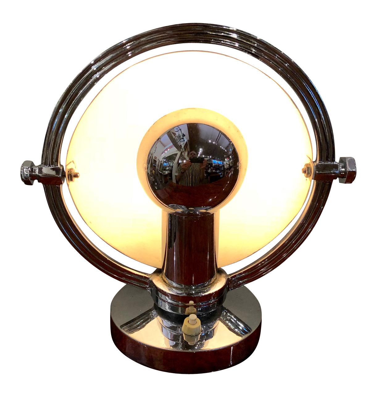 Rare Art Deco industrial light. Half rounded metal top that can be used in multiple positions. Acquired in Argentina but in the style of some of great looking designs by American industrial designers like Walter Dorwin Teague, Raymond Loewy, Henry