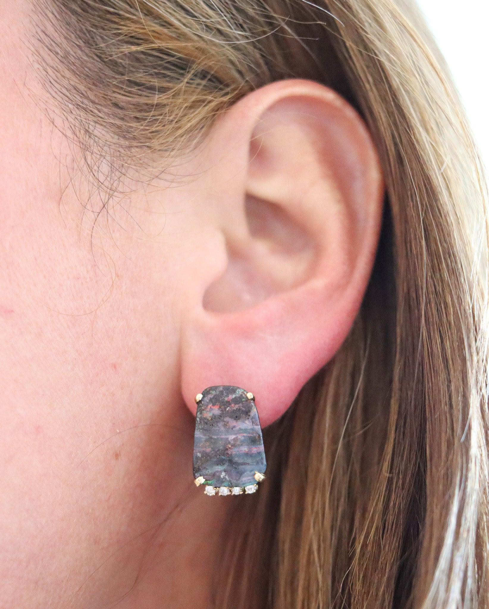 Modernist earrings with boulder opals.

These are a beautiful modernist studs’ earring, created in Australia with semi rectangular baskets shapes in solid yellow gold of 14Kt with high polished finish. They are mounted with a great pair of natural