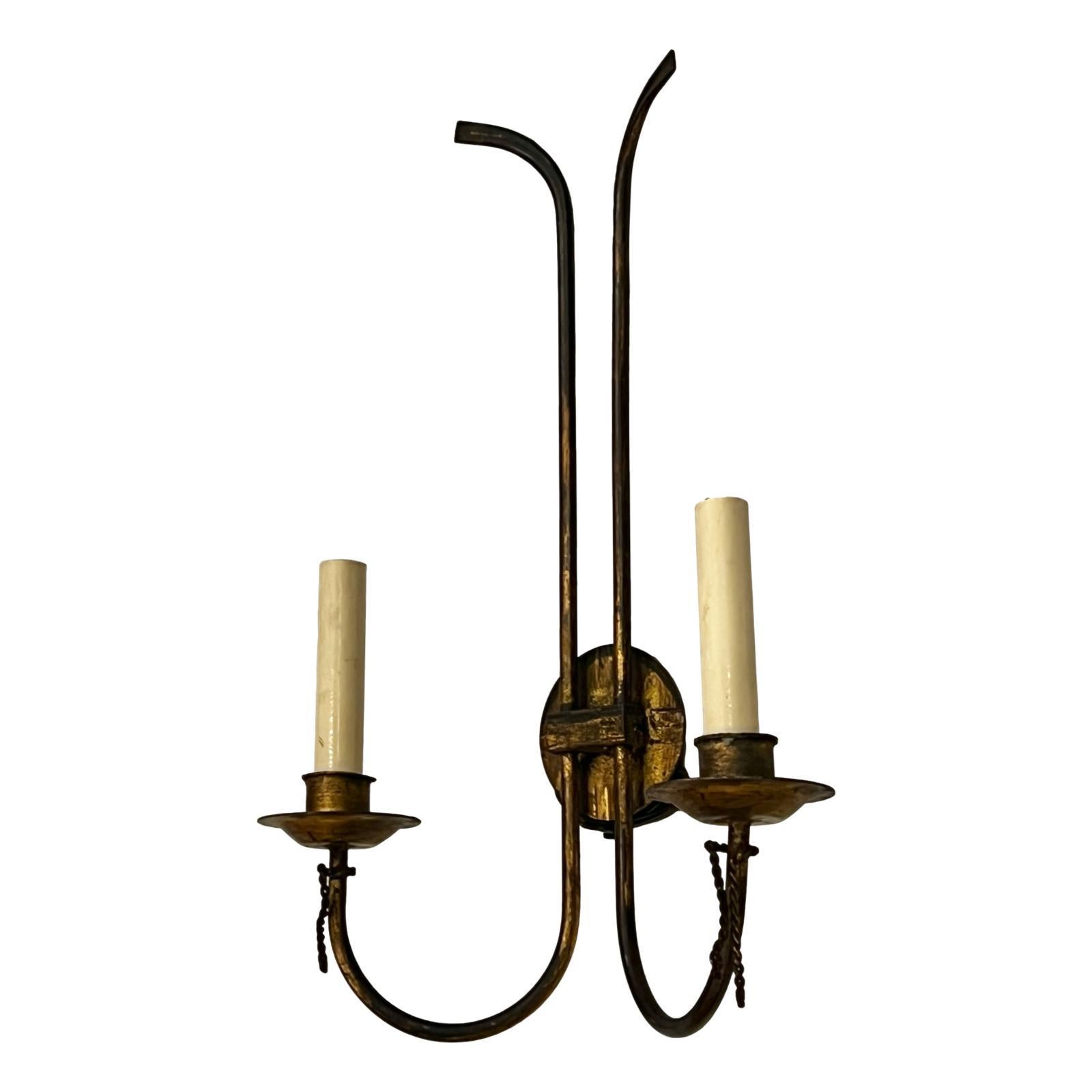 Pair of circa 1940's French gilt metal moderne style double light sconces.

Measurements:
Height: 17