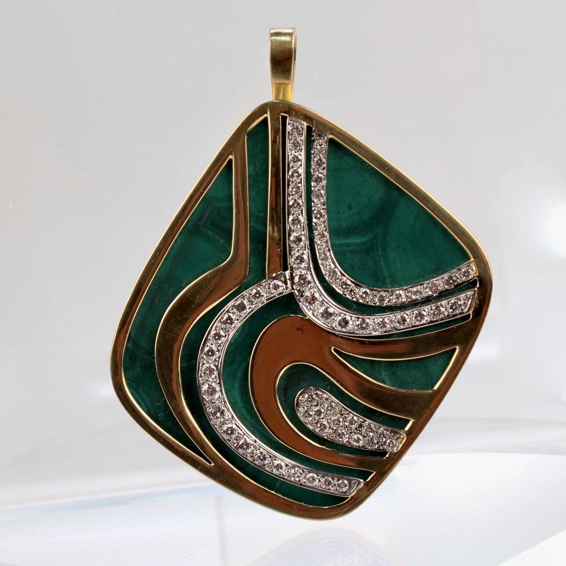 A very fine Swiss modernist 18k gold, diamond, and malachite pendant brooch by Weber & Cie.

With a large flat malachite cabochon bezel set in 18k gold.  

Encased by an organic pattern of three bands of yellow gold and three bands of white gold