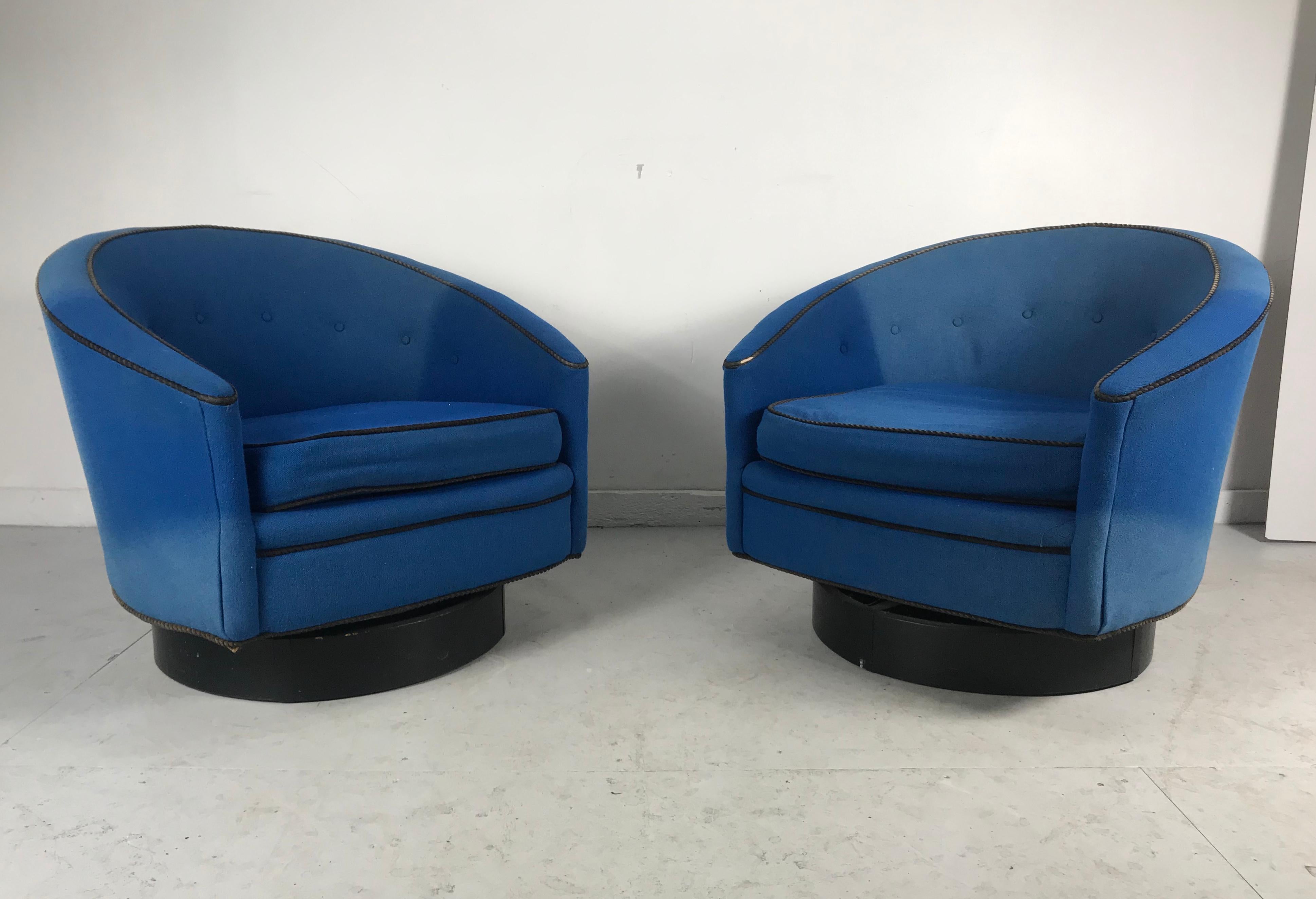 Stunning pair of Modern Regency swivel lounge chairs designed by Lawrence Peabody, Richardson Nemschoff, retain original Nemschoff Chairs label, Classic sleek, elegant modernist design, original quality blue wool upholstery, some fading and interior