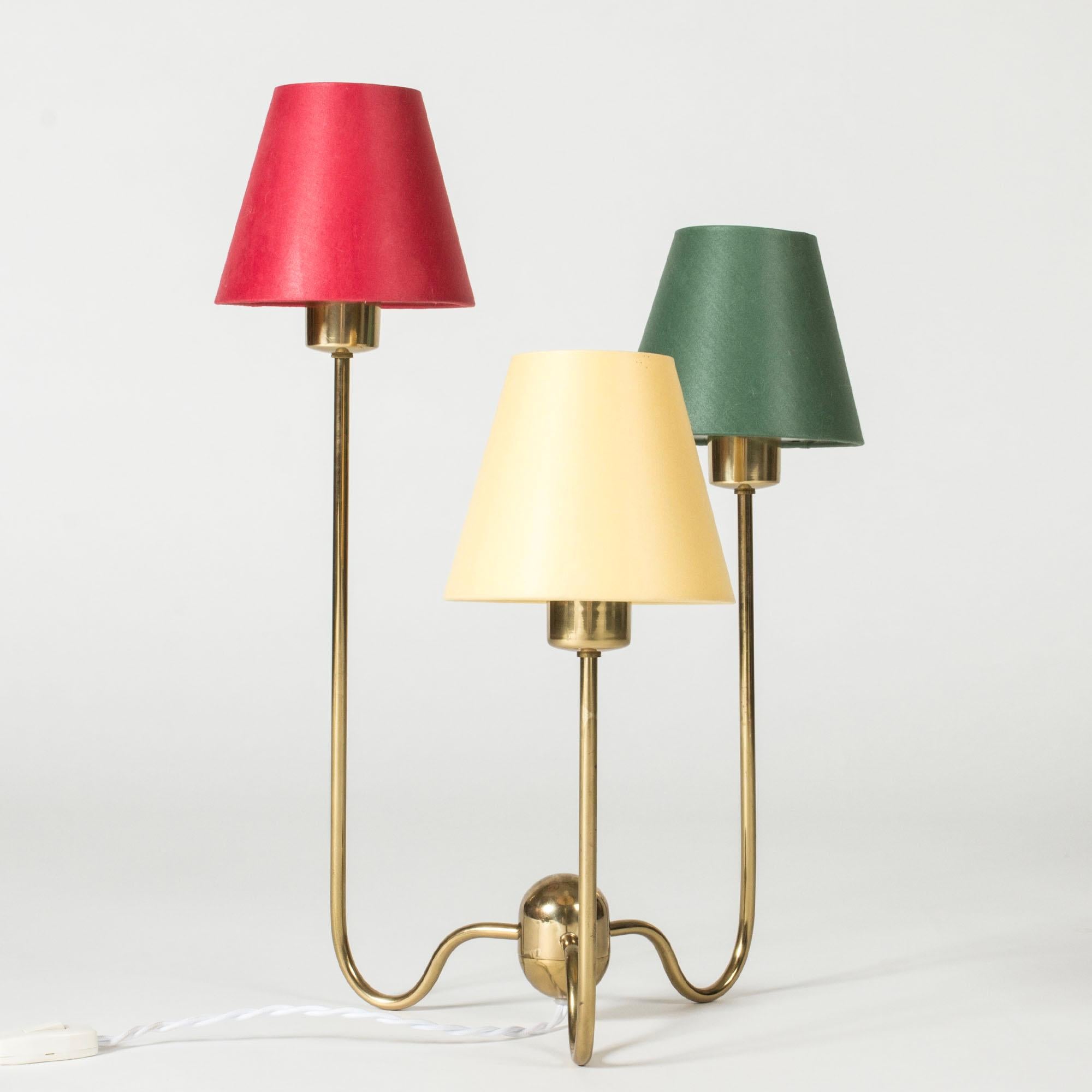 Early edition brass table lamp with three colorful shades by Josef Frank, model #2468. Slender forms that give a voluminous expression and a great general, soft spreading of light.
