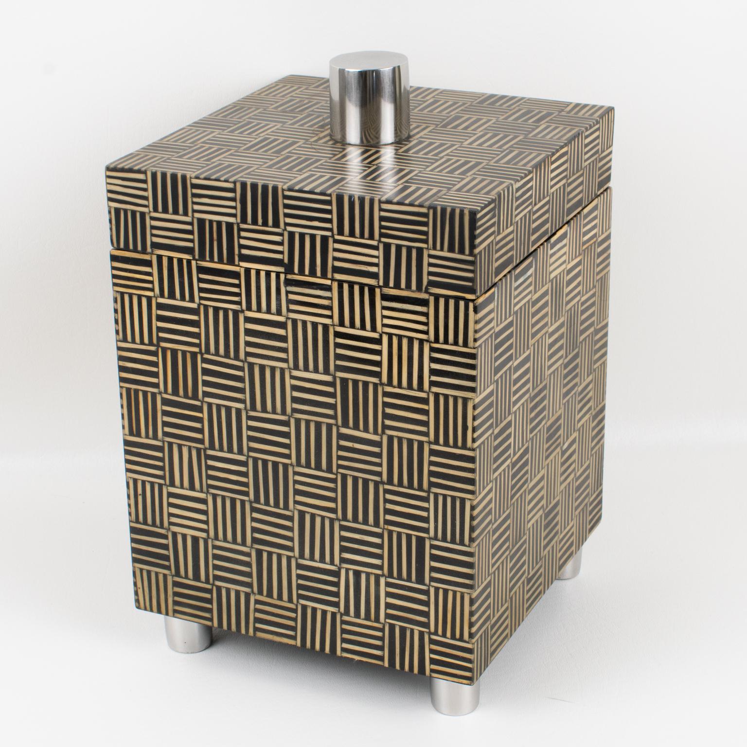 This remarkable modernist decorative box dates back to the 1970s. The piece boasts a tall structure that will capture anyone's attention. The box is square and features an interior made of solid tropical wood. What's unique about this box is the