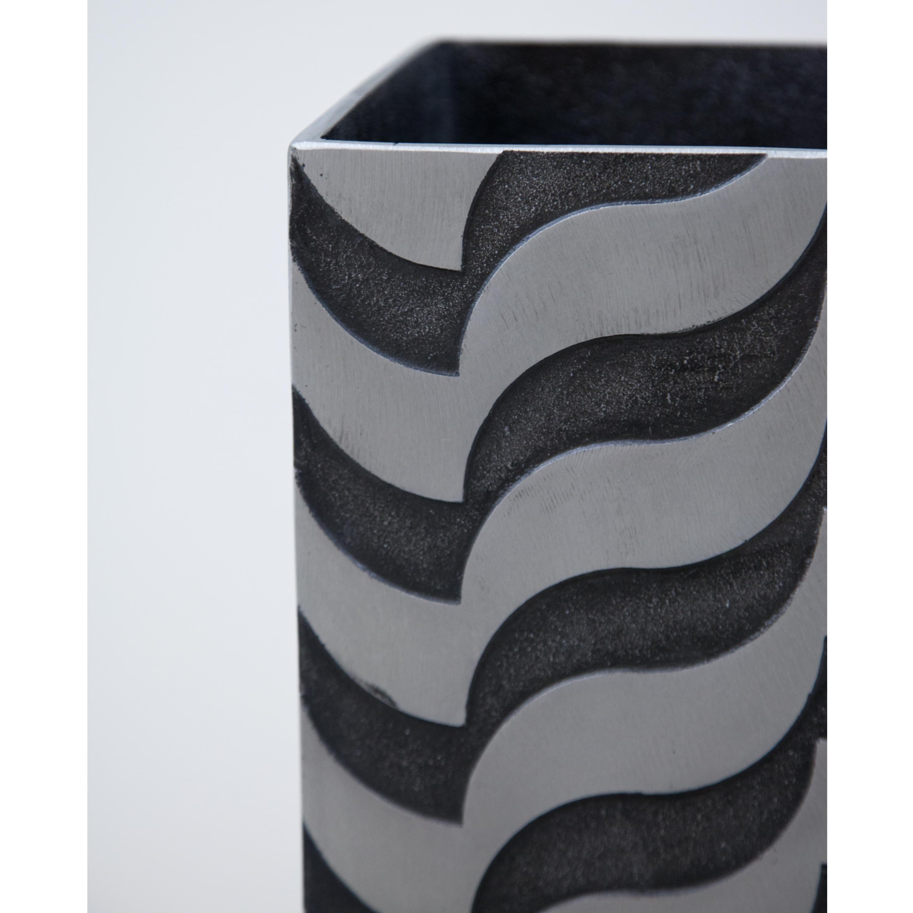 A sculptural modernist tall vase
by artist Lorenzo Burchiellaro.
Textured cast aluminum
with wave pattern detail.
  