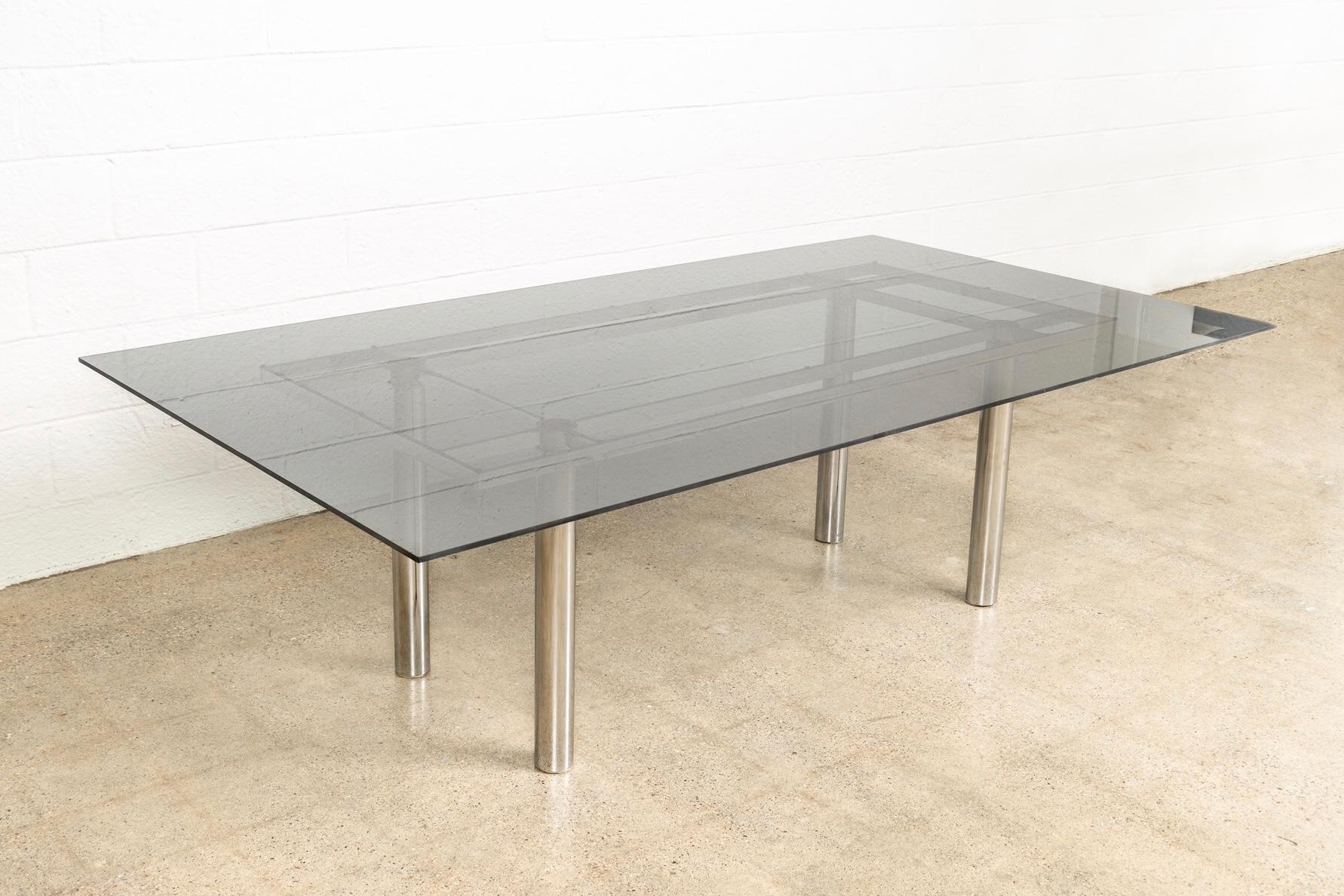 This large modernist “Andre” rectangular glass and chrome table designed by Tobia Scarpa for Knoll International is circa 1970. The table is heavy, solid and exceptionally crafted from premium materials. The sleek design has a clean Minimalist