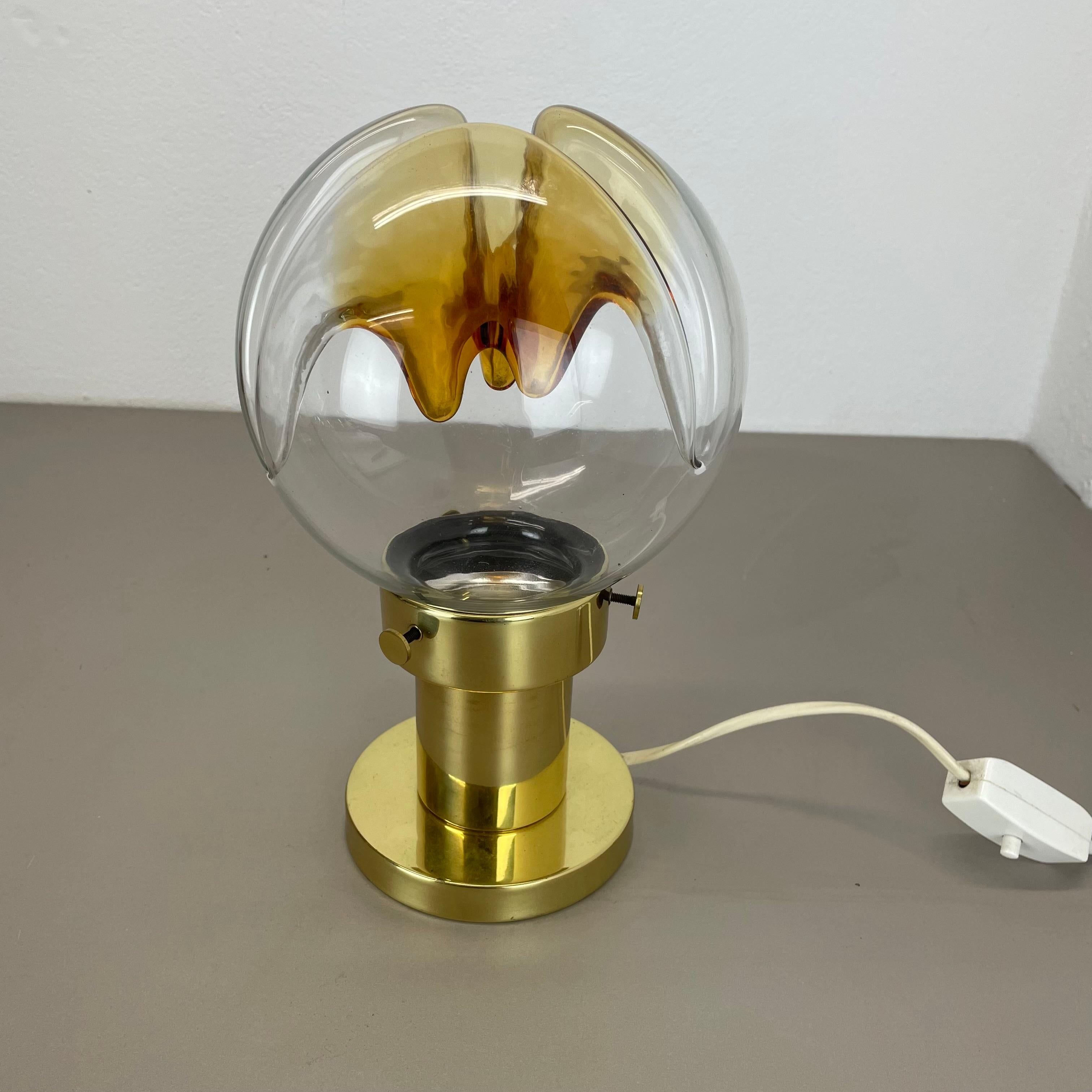 Article:

Table light with Murano glass shade


Producer:

Kaiser Leuchten, Germany


Origin:

Germany



Age:

1960s






This vintage table light was made by Kaiser Leuchten in Germany in the 1970s. it features a colorful very special glass shade
