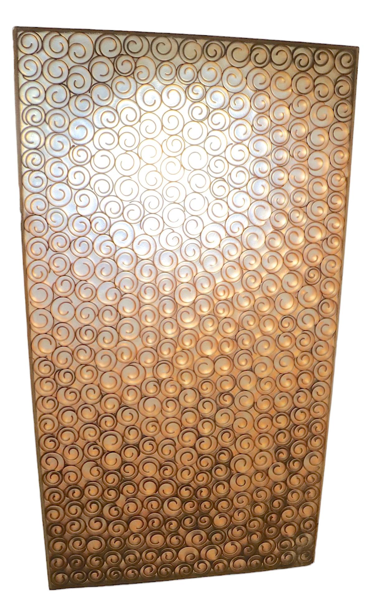 Groovy architectural panel constructed of translucent plastic with embedded wood curlicue elements repeating throughout. I believe this panel was originally a room divider, or some sort of decorative architectural element. This piece is in good,