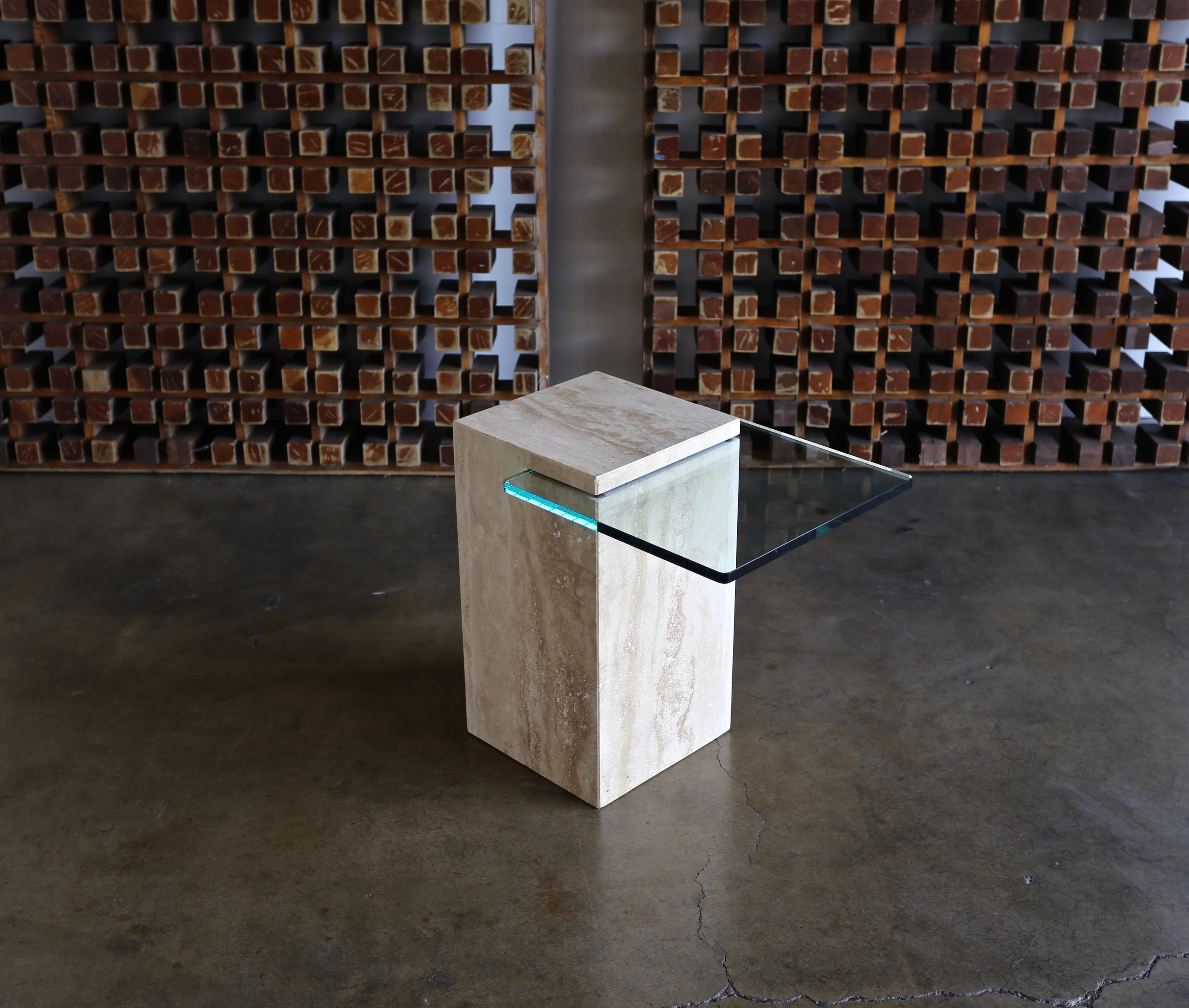 Modernist travertine and glass side table, 1970s

From the floor to the top of the glass measures 20.38