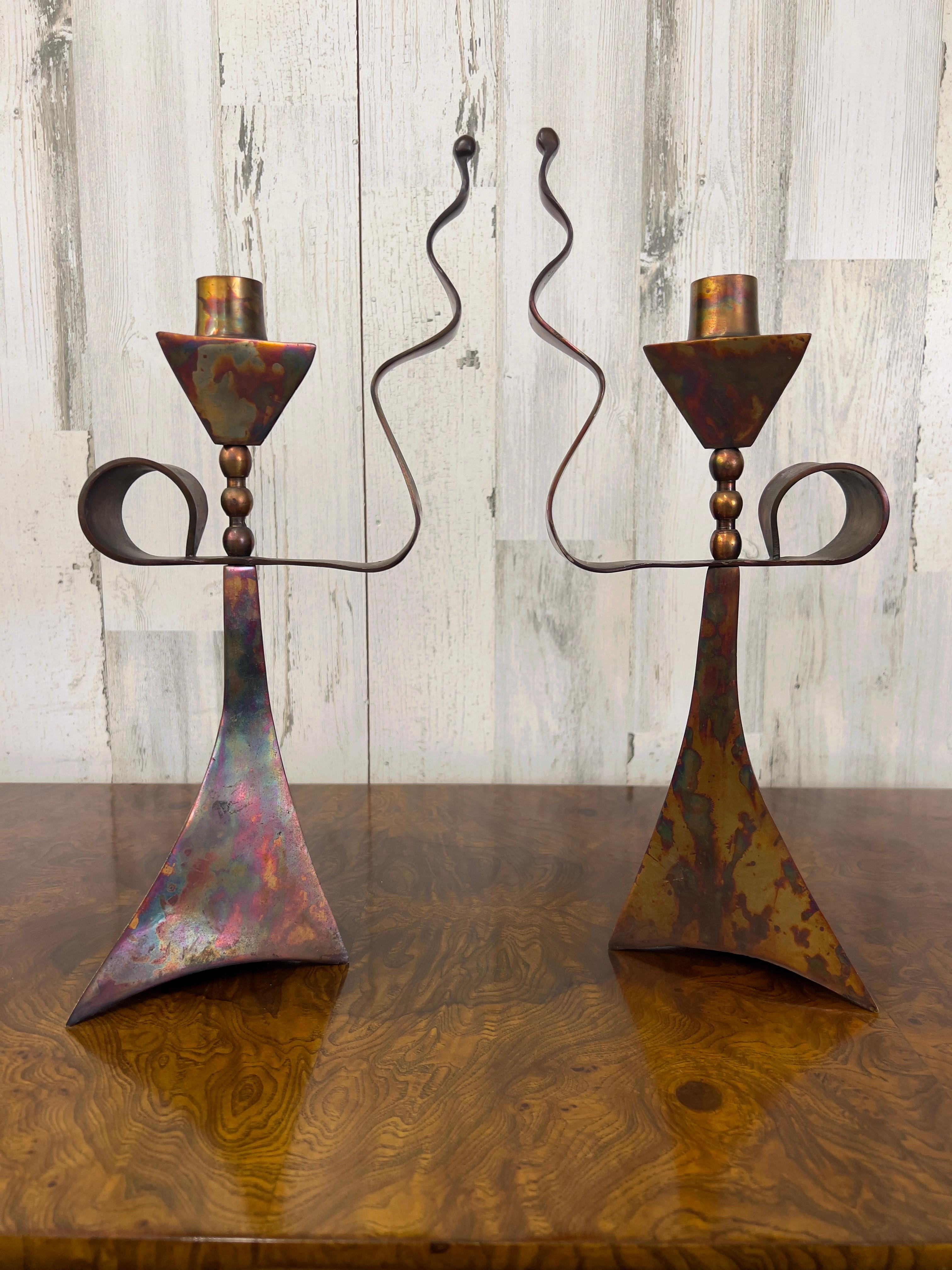 Whimsical triangular acid washed copper candlesticks with handle.