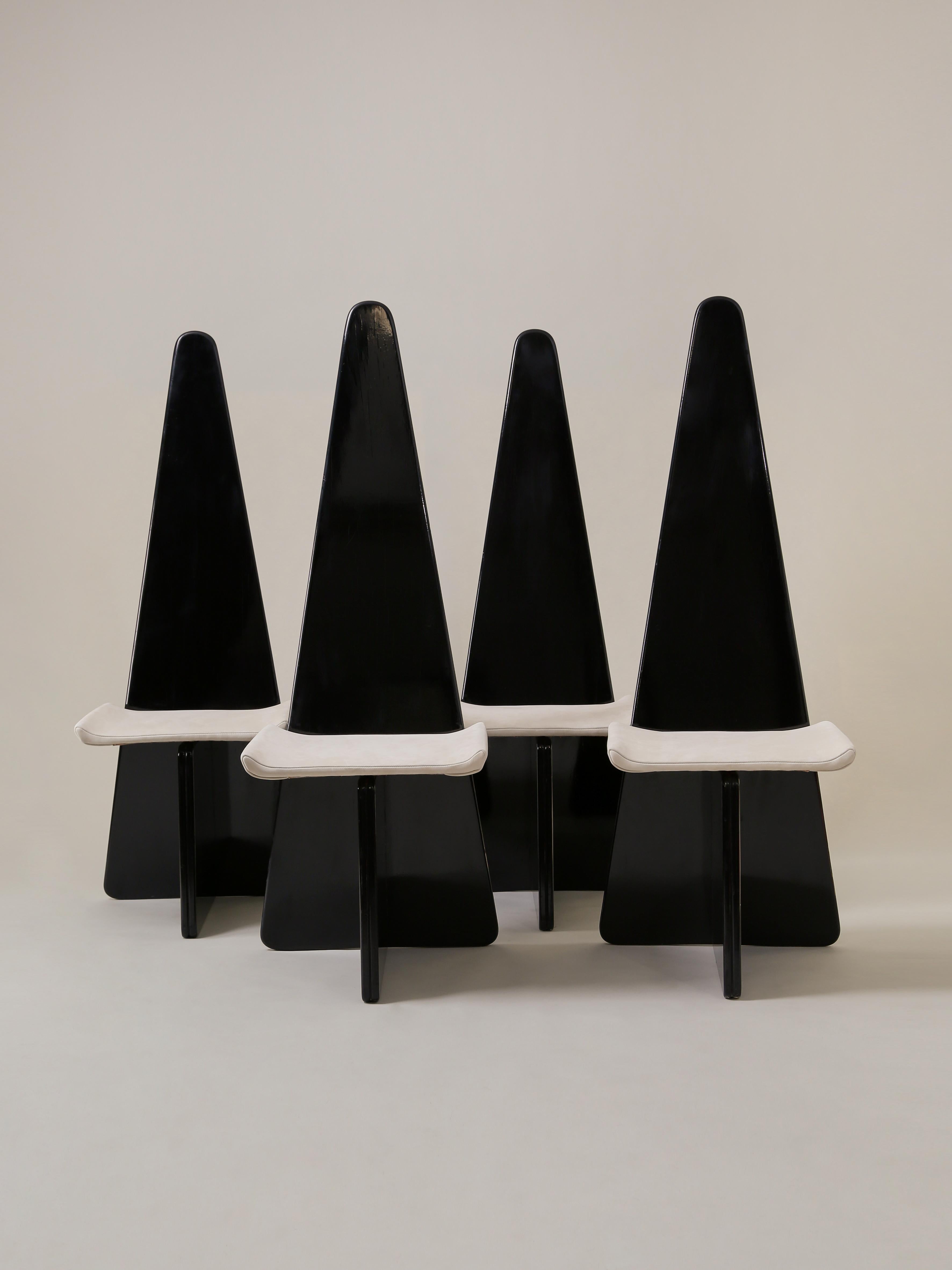 This set of striking modernist chairs, in the style of Claudio Salocchi, features a black-lacquered wood base and a newly reupholstered seat in bone suede. The Sormani Edition chairs, stamped SORMANI, are circa 1970s Italy.

Measures: overall