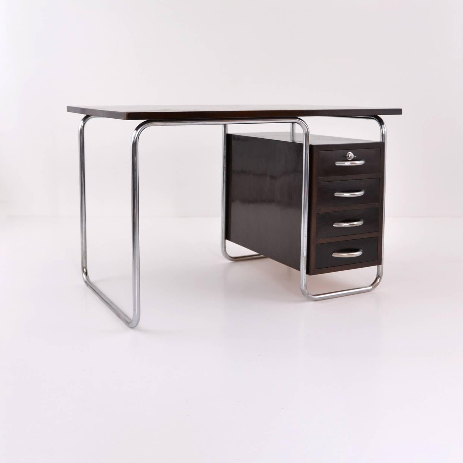 Modernist tubular steel and stained wood desk in the new objectivity style (Neue Sachlichkeit), designed and produced by Rudolf Vichr, Prague, circa 1930.