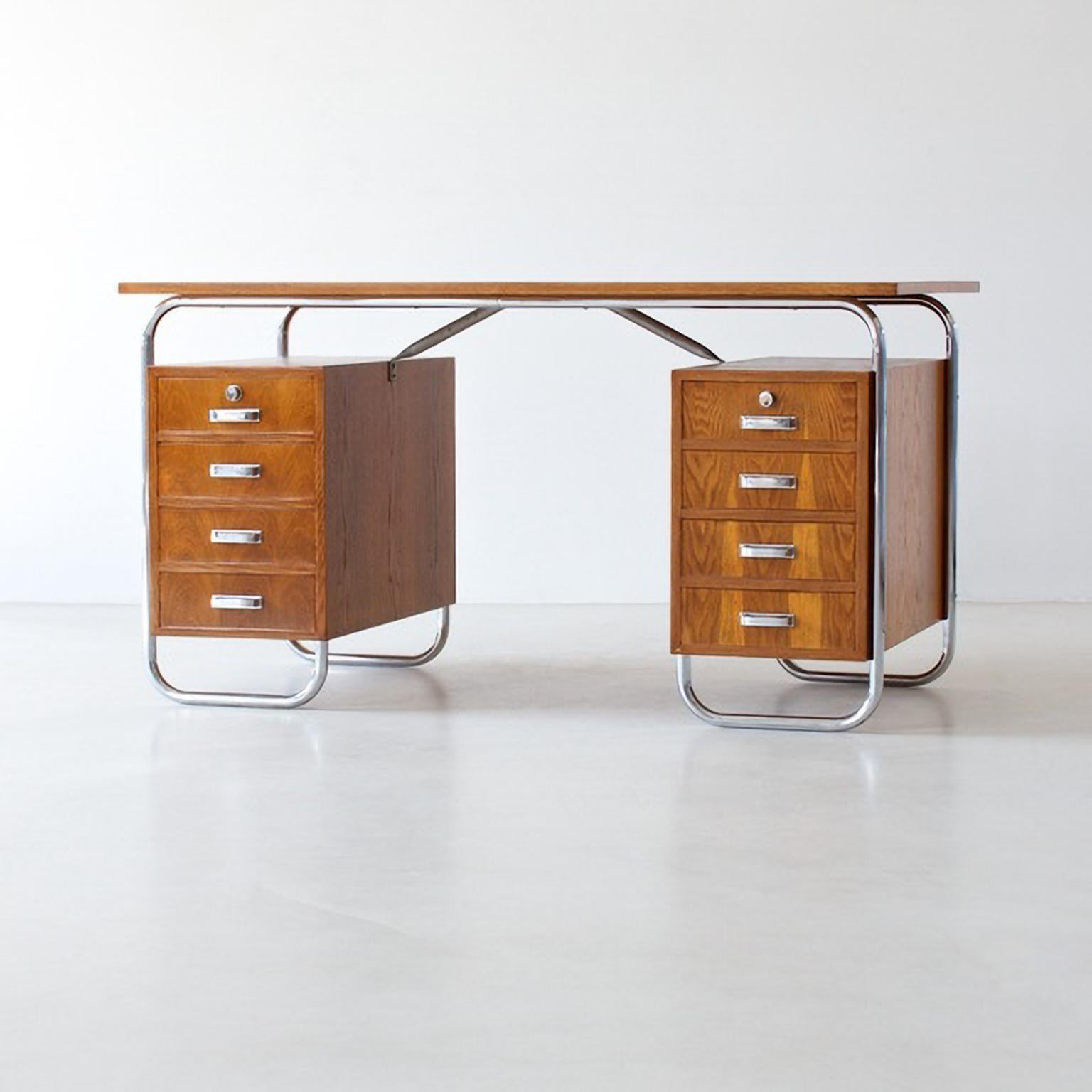 Modernist tubular steel desk with two chests of drawers, chrome plated metal, oak veneer, circa. 1935.
