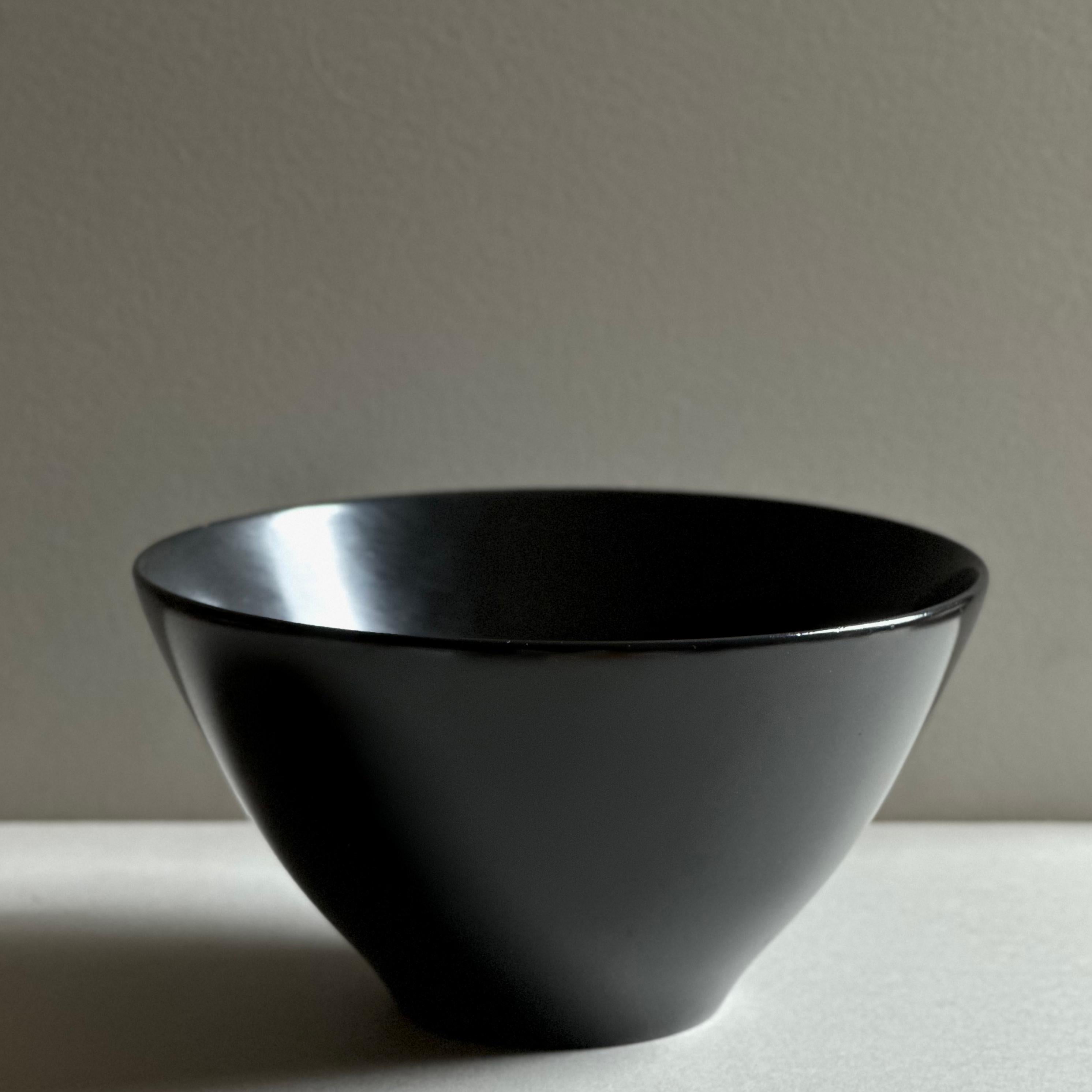 A modernist, turned mahogany bowl with a hand-rubbed satin black finish. Unsigned, circa 1970.