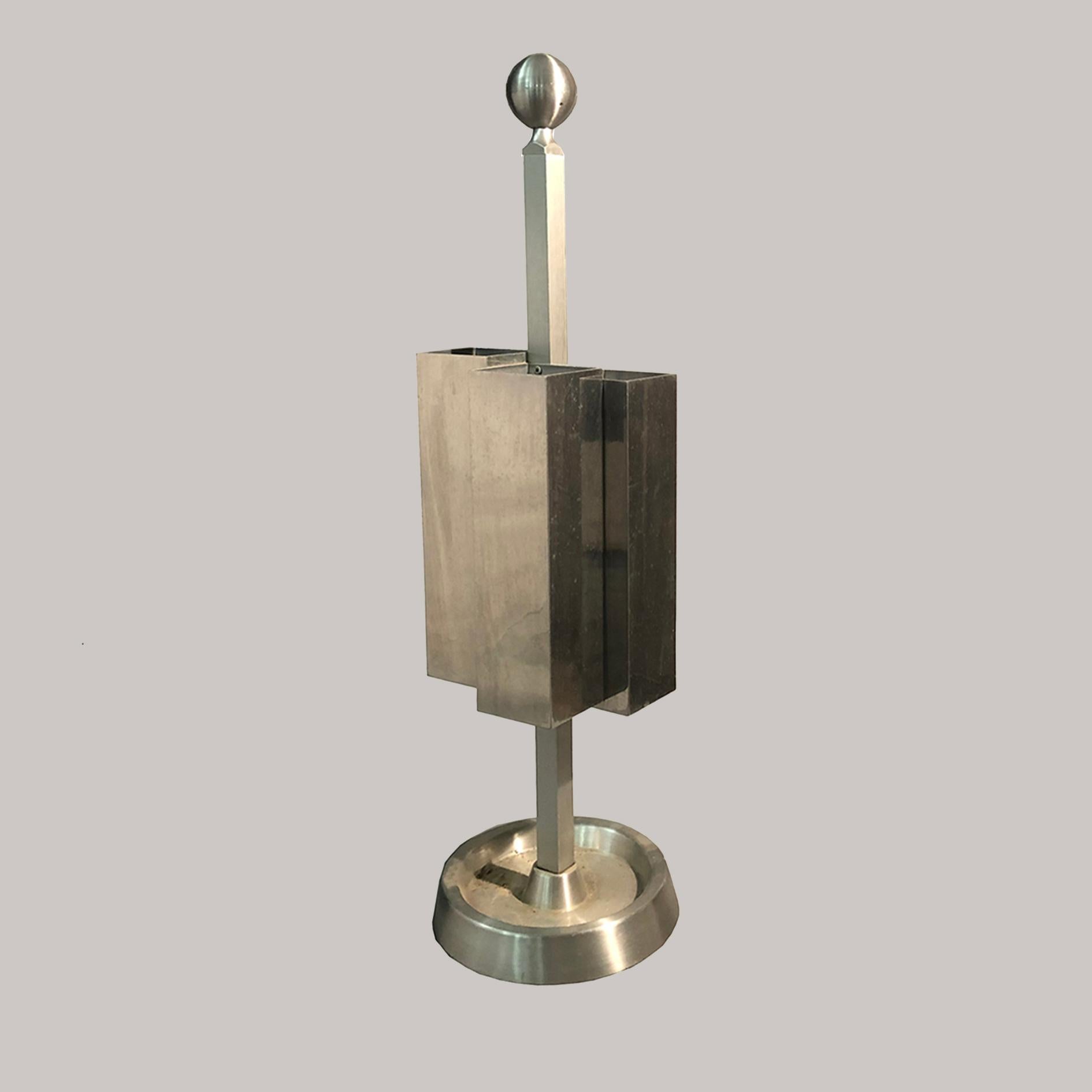 Modernist umbrella stand. 
The body is made of aluminum in cubist style. Very unique and rare item custom made for a pharmacy in Monza, Italy, 1970's.