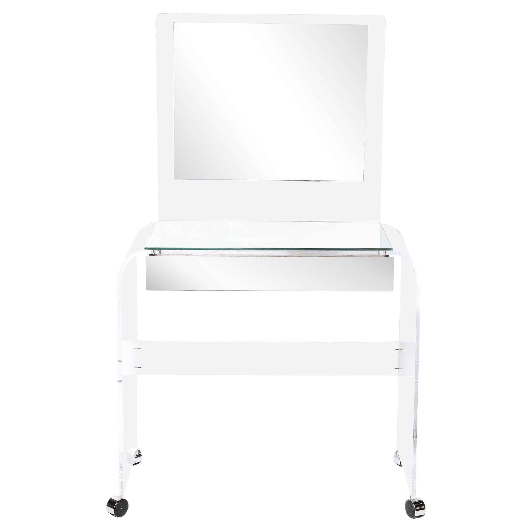 This Modernist Vanity, originating from the United States, circa 1970. is a unique and elegant example of modernist design. Constructed in Lucite and mirror glass, the piece exemplifies Mid-Century Modernism in its use of minimal, sleek and