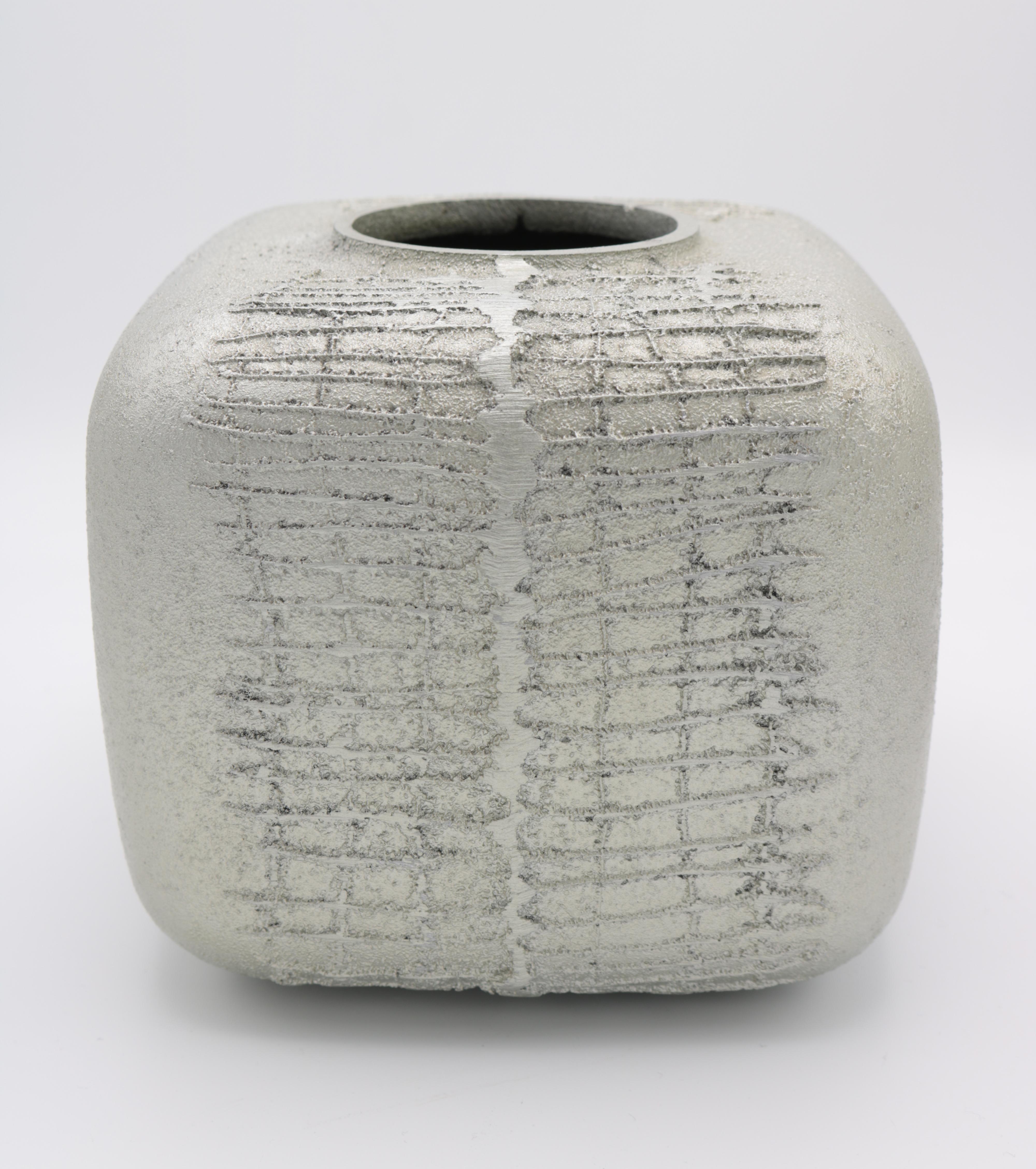 Modernist vase by Lorenzo Burchiellaro. 
Textured cast aluminum.