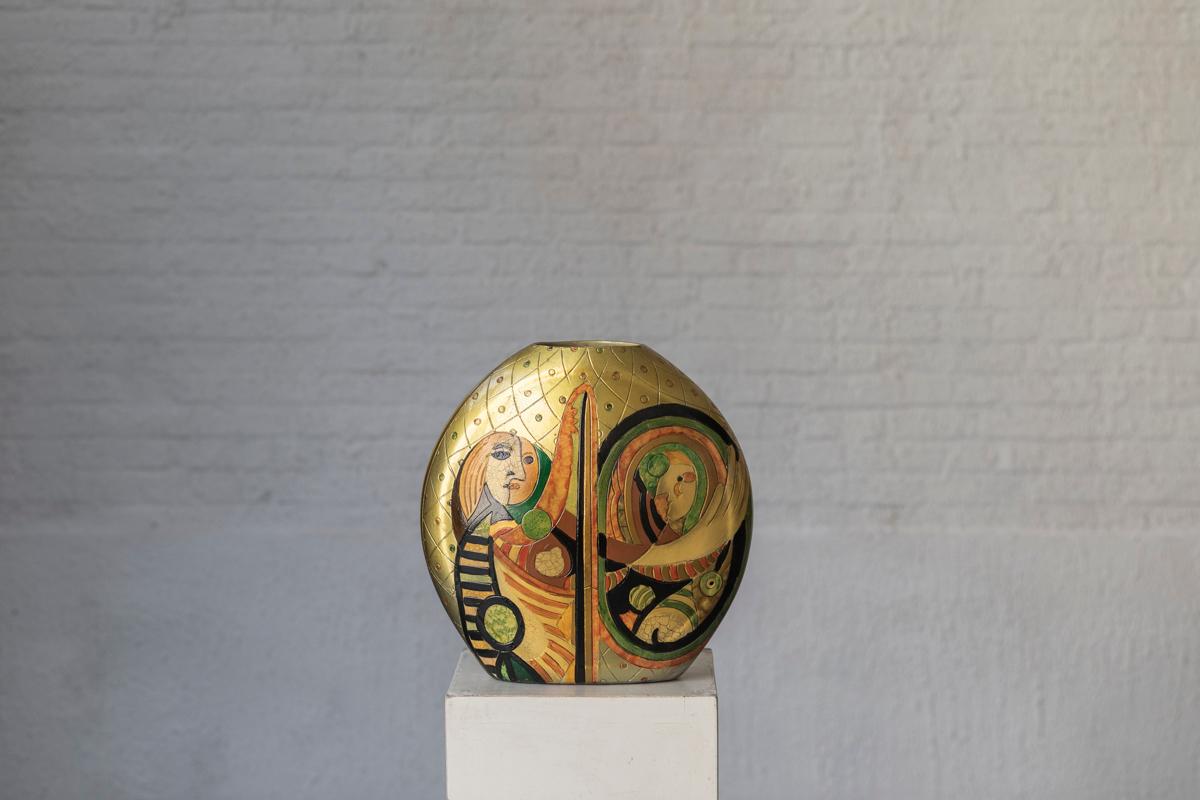 Modernist vase, presumably produced in Italy in the 1970’s. This handpainted ceramic vase has been decorated in the cubist style of Picasso on both sides. Beautiful golden color, rather large in size. The image is the same on each side. In very good