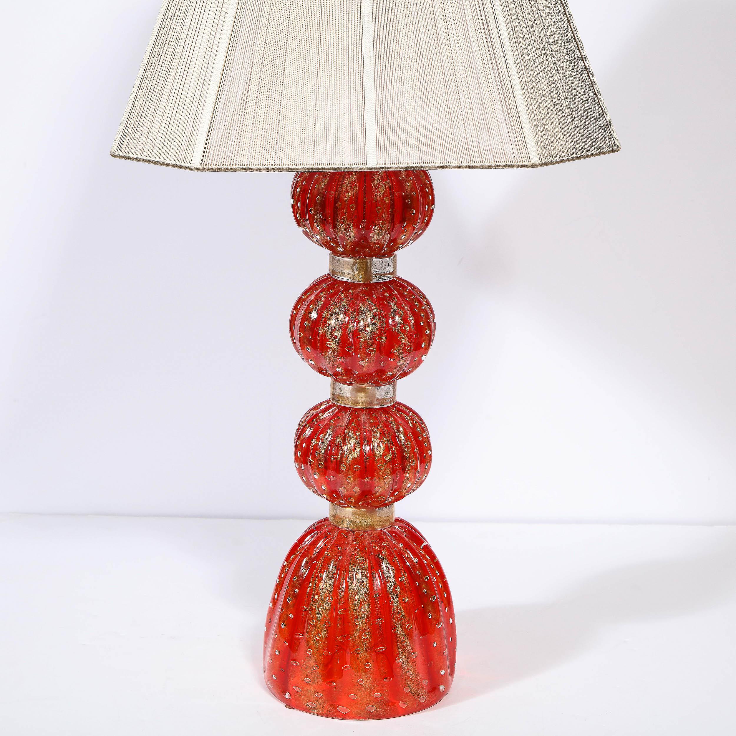 This beautiful modernist lamp was realized in Murano, Italy- the island off the coast of Venice renowned for centuries for its superlative glass production- during the latter half of the 20th century. It features a domed based upon which three