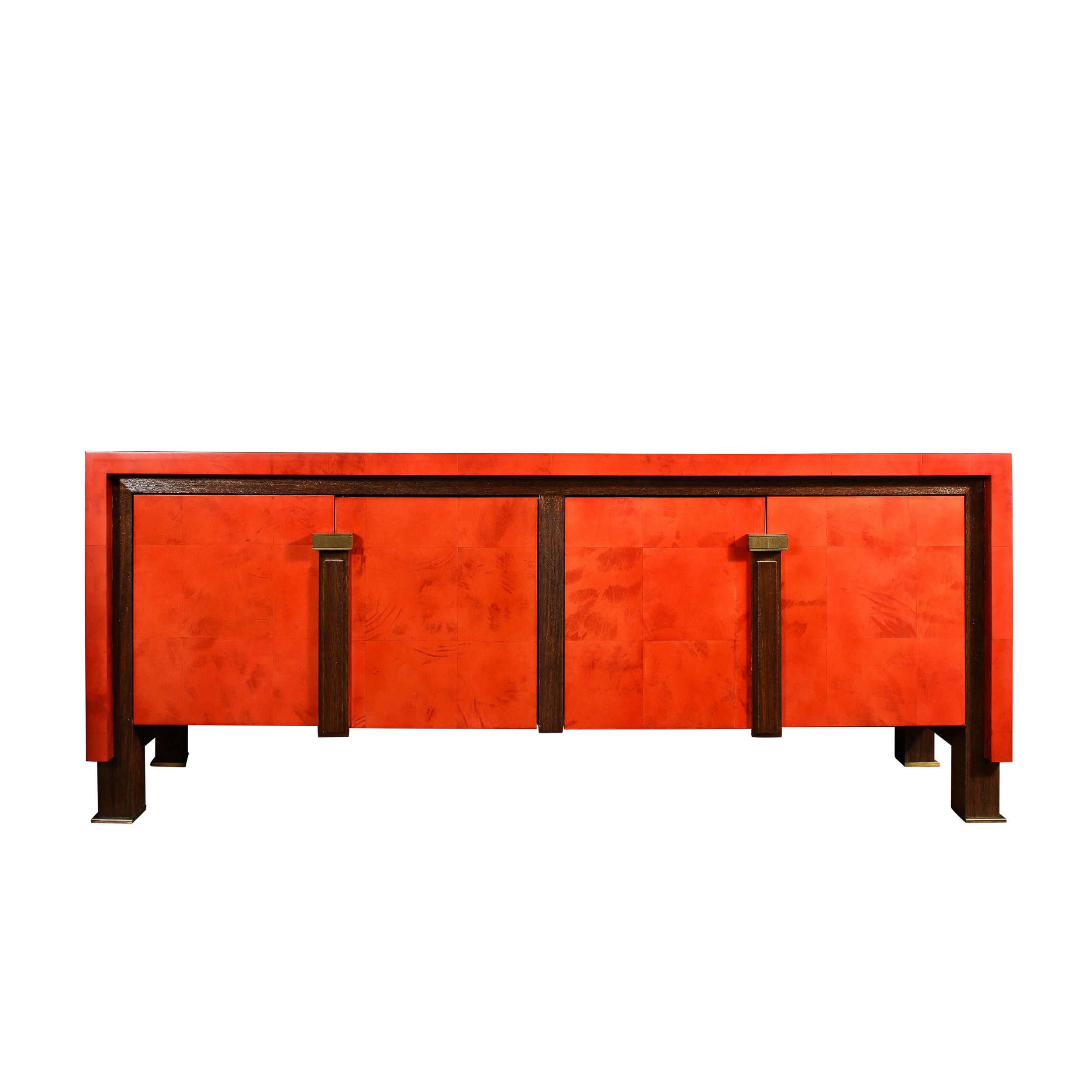 This stunning and sumptuous modernist sideboard was realized in the United States during the latter half of the 20th century. Inspired by the work of the legendary design luminary Karl Springer, this sideboard offers a volumetric rectangular body
