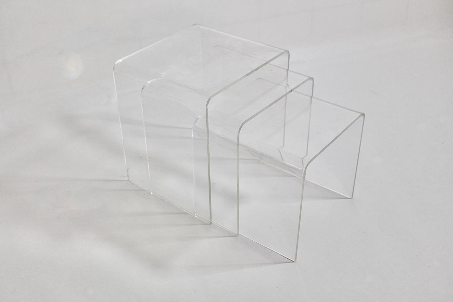 Modernist vintage nesting table from lucite in beautiful waterfall form 1970s Italy.
A wonderful set of three ( 3 ) tables in different sizes - nesting tables or stacking tables - in waterfall like shape. Perfect to work as side tables or sofa