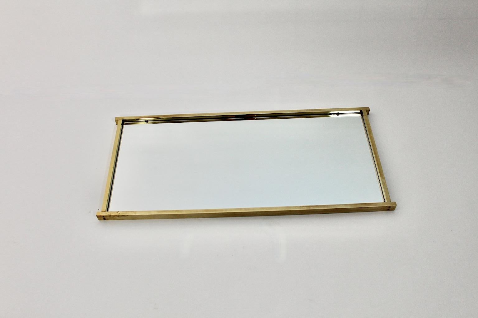 Modernist vintage rectangular like floor mirror or wall mirror from brass Italy 1970s.
An elegant and beautiful floor mirror or wall mirror with angular edges from brass in sleek shape.
This wonderful wall mirror was designed to anchor your interior