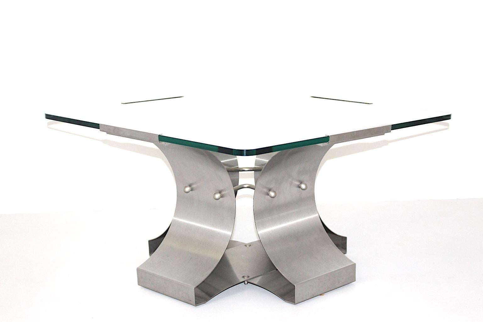 Modernist vintage square coffee table by Francois Monnet from stainless steel and glass 1970s France.
A fabulous coffee table in rare size from stainless steel and clear glass with a marvelous sleek and simple chic. With this sophisticated vibes and