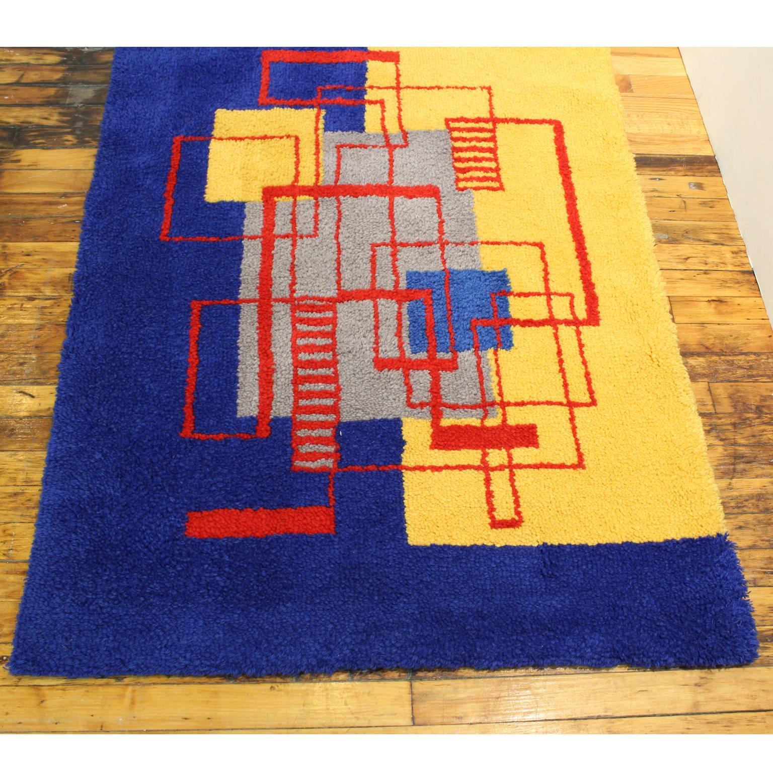 A hand-hooked modernist style wall rug, original design after Robert Mallet-Stevens. The initial rug kit was purchased and put together by the original owner with colors of his own choice. Good condition, has been hanging since it was made.