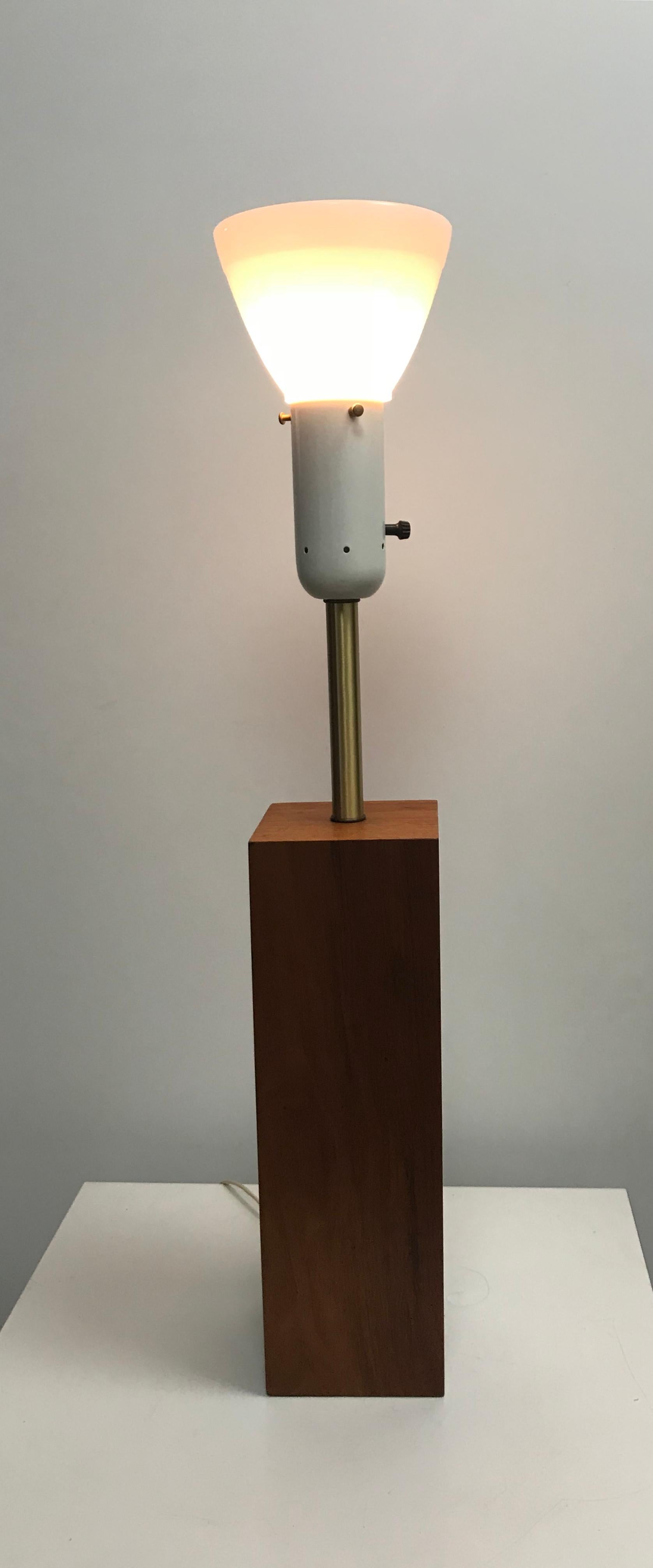 Modernist walnut and brass table lamp by Walter Von Nessen, stunning walnut base, brushed brass standard, retains original milk glass cup shade.