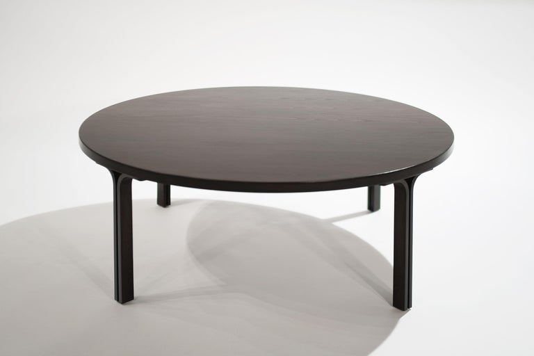 Sculptural coffee or cocktail table executed in ebonized walnut in the style of Knoll, United States, circa 1970s. Completely restored, topped with our scratch and water-resistant finish.

Other designers from this period include Eero Saarinen,