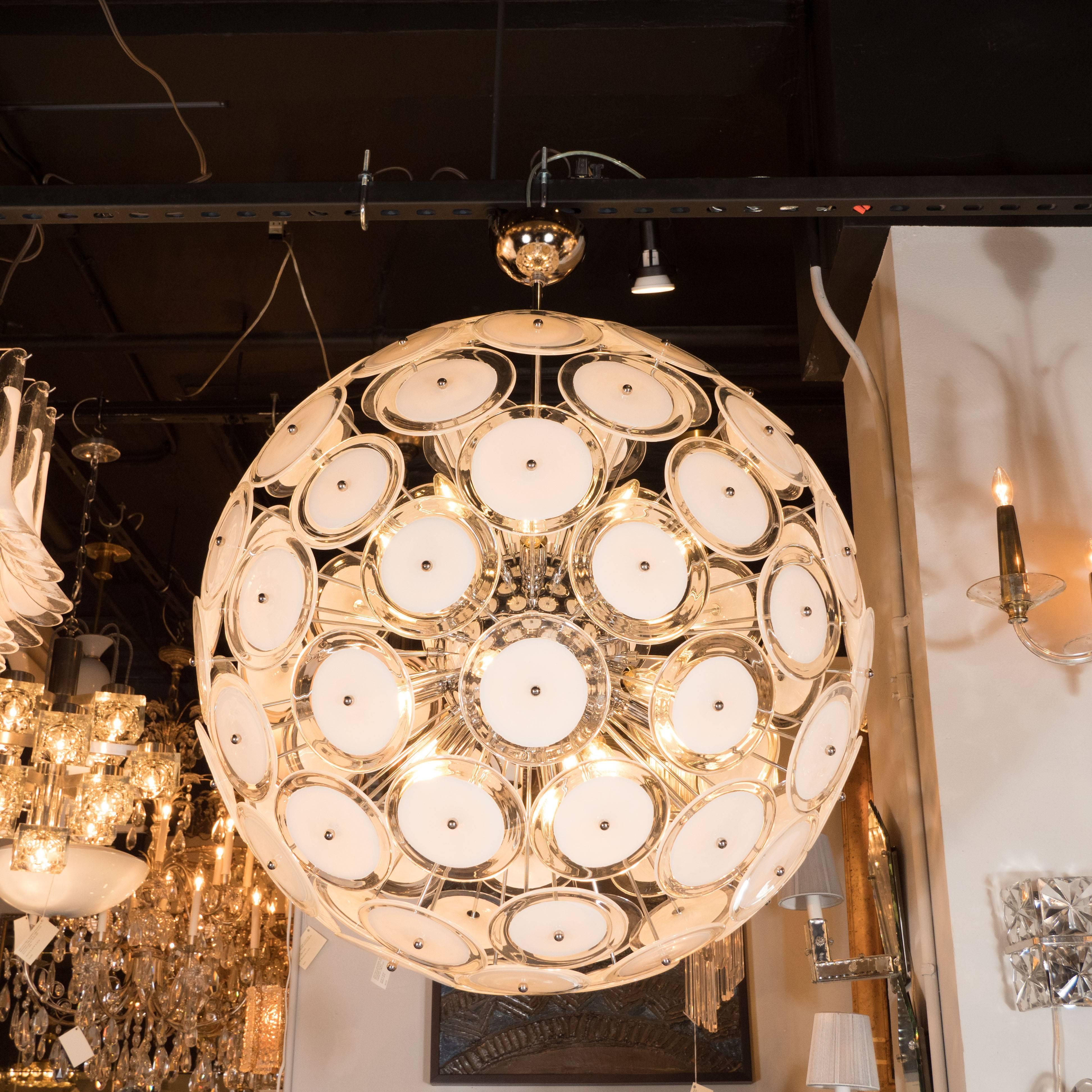 This stunning and dramatic chandelier was realized in Murano, Italy- the islands off the coast of Venice renowned for centuries for their superlative glass production. Created in the same manner since the 1960s, in the manner of Vistosi, features an