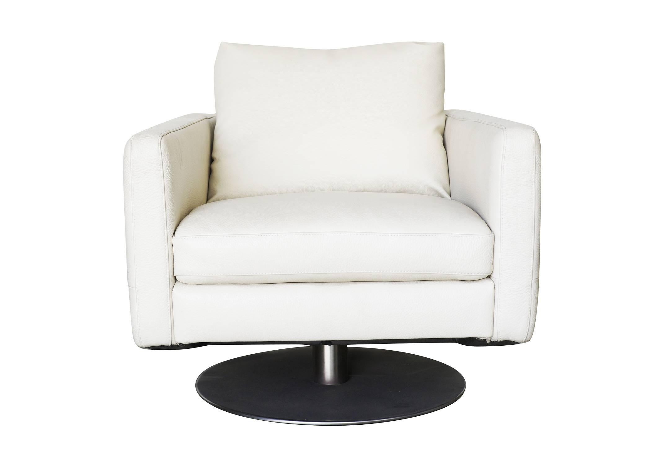 Modernist white swivel lounge chair with brush steel base and heavy vinyl covers by Permaguard.

Avalible: Two.