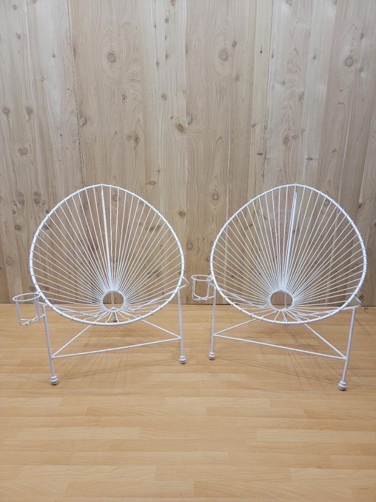 Modernist white wire garden chairs in the manner of Mathieu Matégot - pair.

Stunning pair of Mathieu Mategot style white iron wire garden chairs that feature an amazing oval clamshell architectural design, attached cup holders and an overall