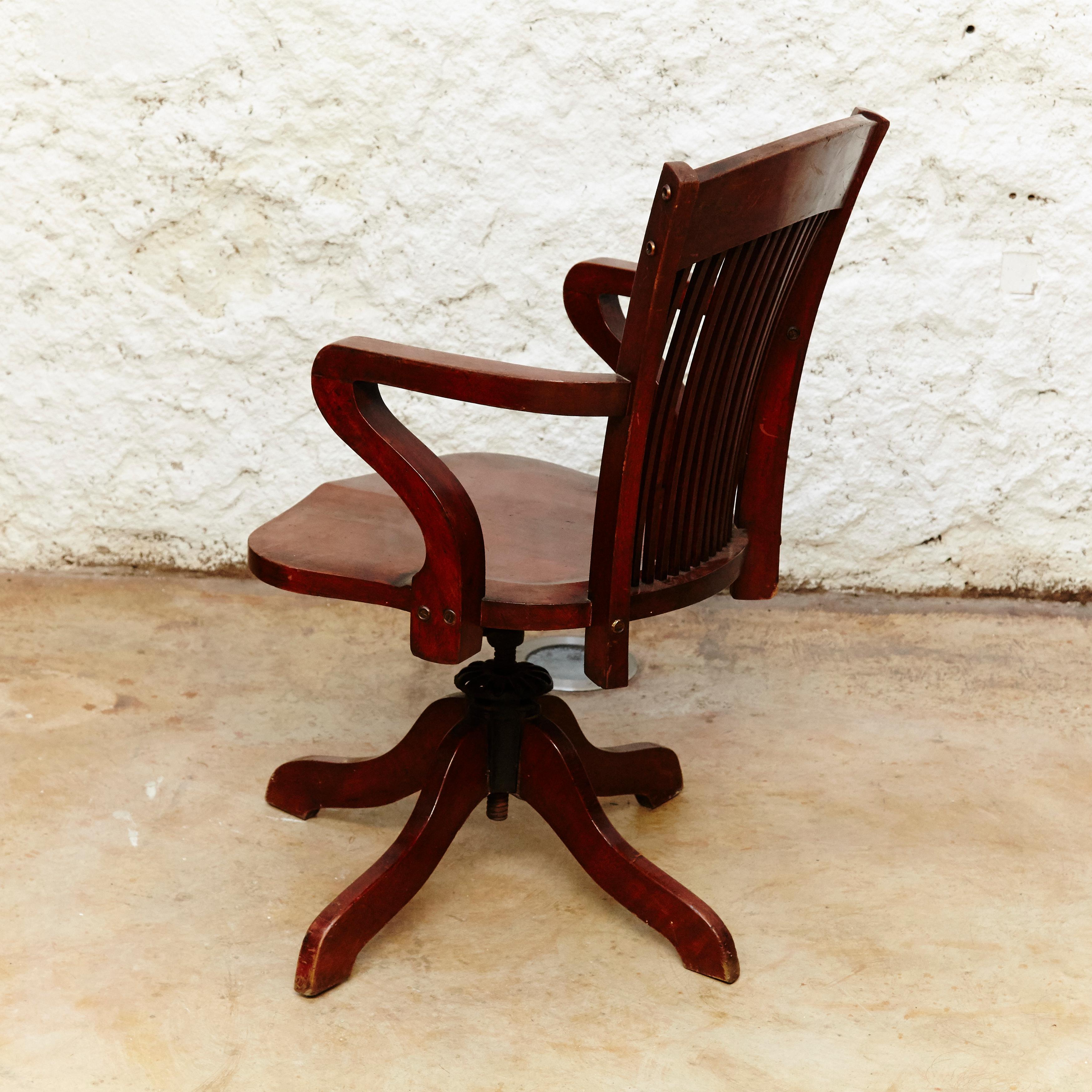 Modernist swivel chair by unknown designer.
Manufactured in Barcelona circa 1940.
Wood.

In original condition with minor wear consistent of age and use, preserving a beautiful patina.