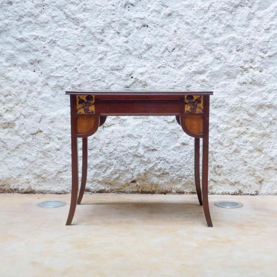Modernist wood table with upholstered top, circa Early 20th century.
By unknown manufacturer from Spain.

In original condition, with minor wear consistent with age and use, preserving a beautiful