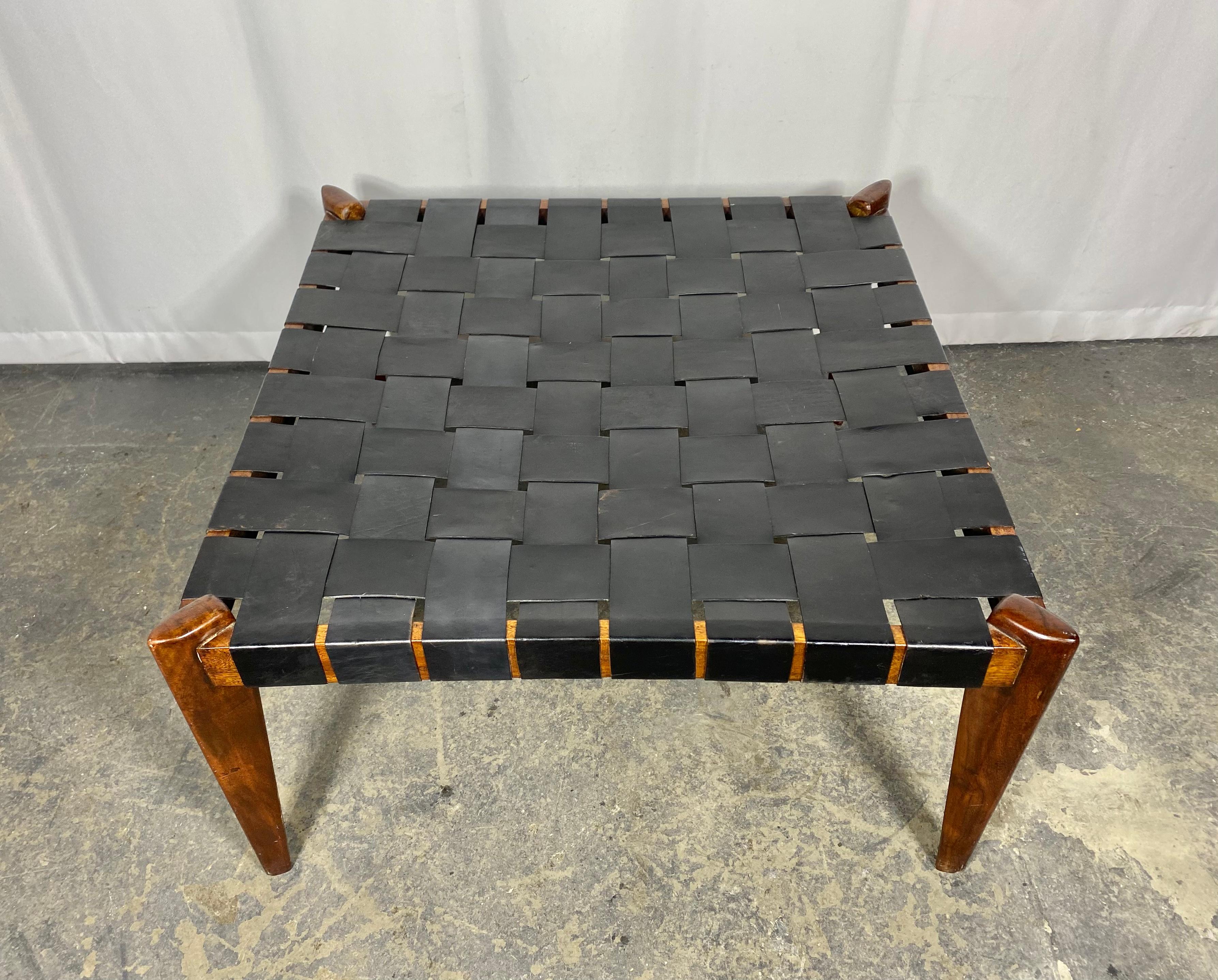 Beautiful midcentury table / ottoman designed by Edmond Spence features a woven leather top with a rosewood base. Nice original condition,, age appropriate wear..(see photos) Hand delivery avail to new York City or anywhere en route from Buffalo ny