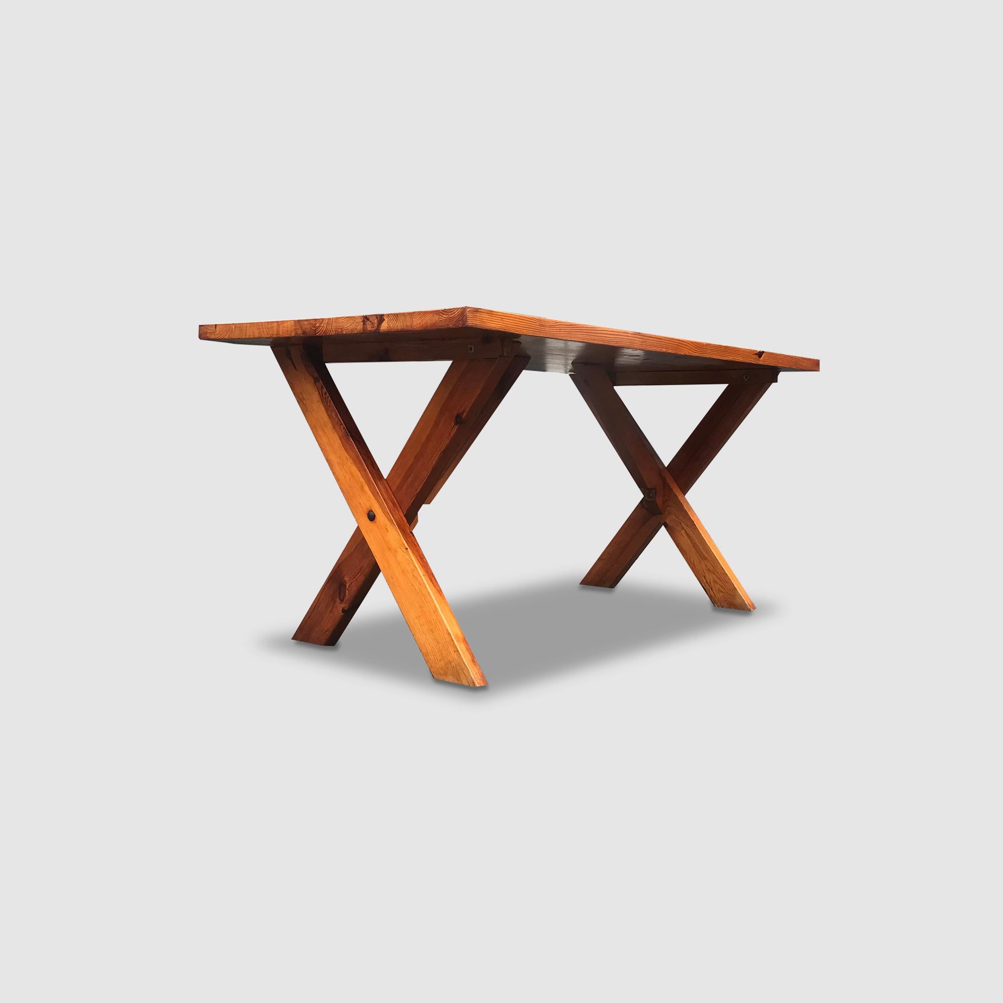 Solid pine wood dining table, with beautiful X-base construction, produced by Ate van Apeldoorn for Houtwerk Hattem. 

The X-base is supported by a solid beam tilted in a 45 degree angle.

In typical Van Apeldoorn fashion; built solid and with