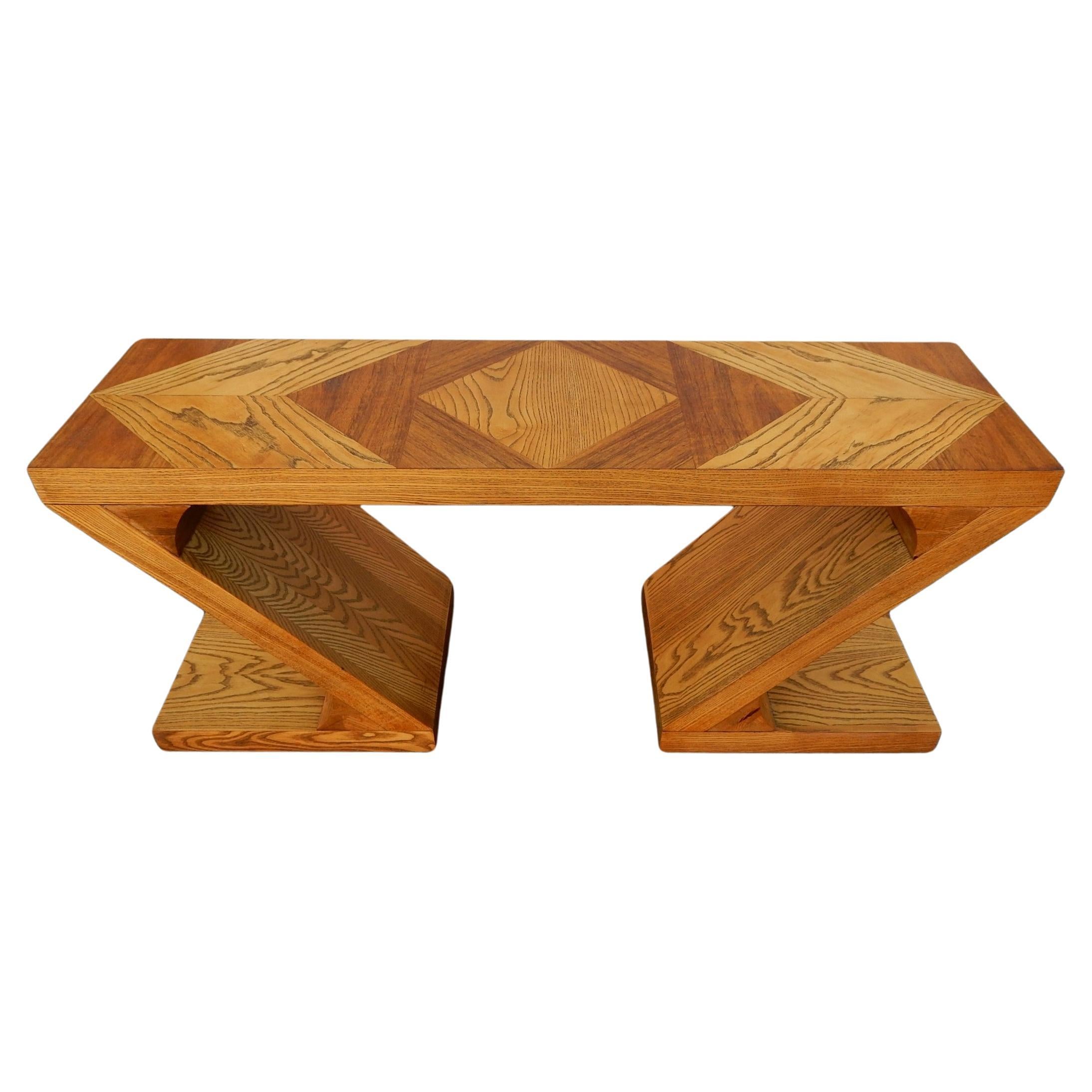 This is a rare & seldom ever seen zig zag sofa table in an amazing two tone tiger grain oak. Manufactured by The Lane Furniture Company, USA. 
Visually spectacular with patchwork design. This is a solid and very heavy piece in well cared for