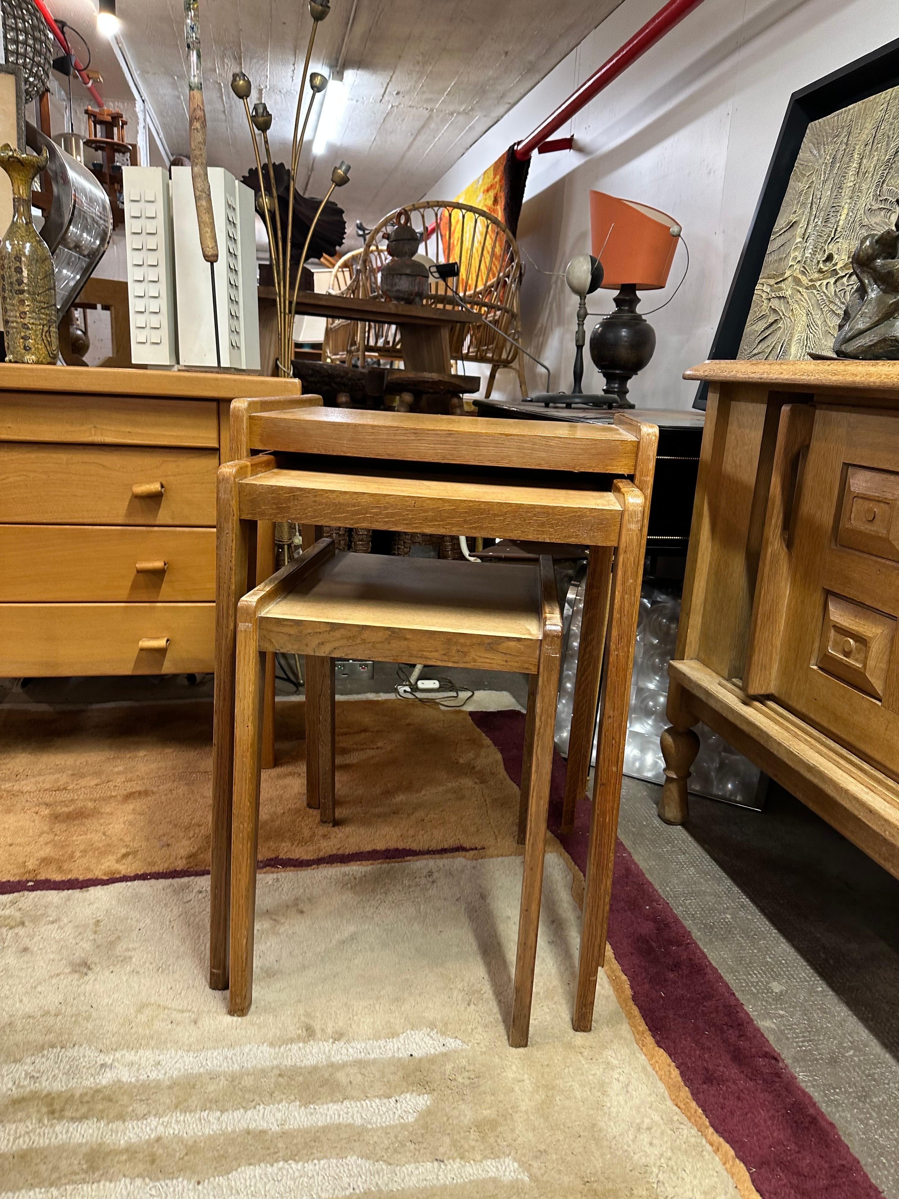 A set of 3 nesting tables unusual height.