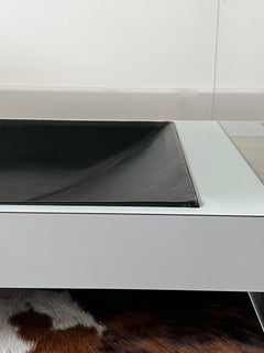 Modernistic coffee table in acrylic, glass, melamine and leather, 1970