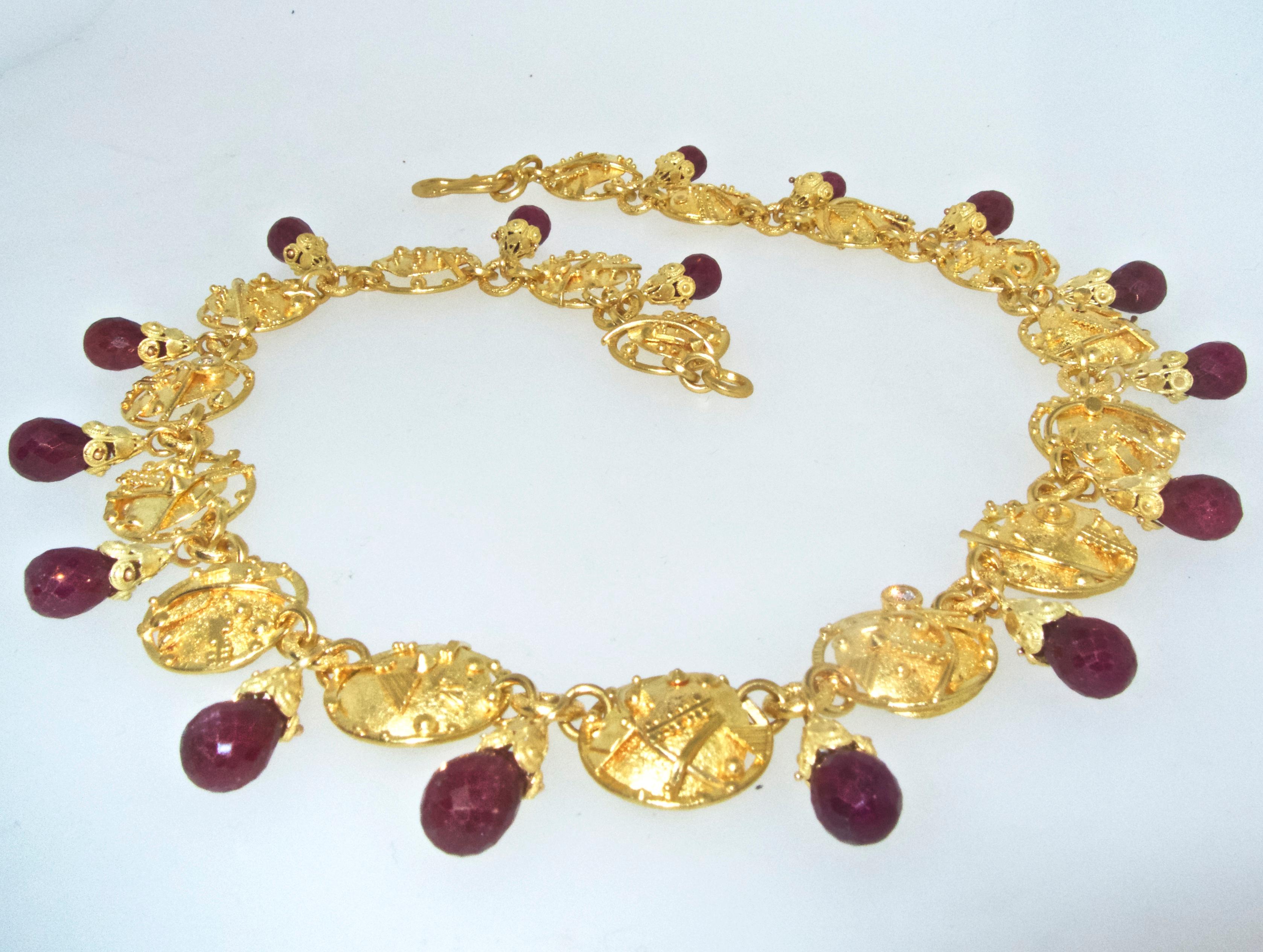   Gold necklace, 22k, with hanging faceted tear drop red opaque natural, rubies, small diamonds,  17 inches in length and 124.92 grams.  Signed JB, possibly for Jonathan Bailey, this necklace was certainly done by an avant garde artist, the gold