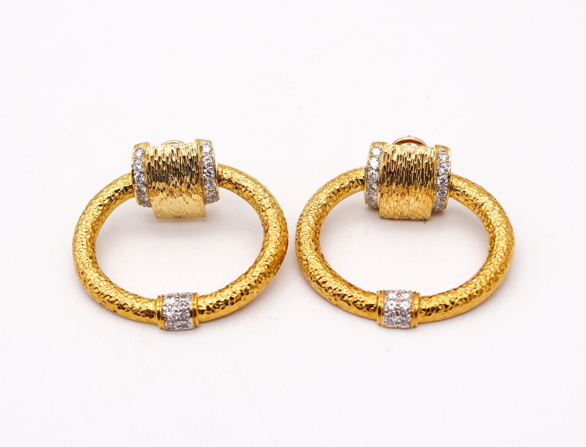 Pair of modernist doors-knocker earrings with diamonds.

This is a gorgeous pair of doors-knocker earrings created in Italy during the modernist period, back in the 1970's. The earrings are a great statement carefully crafted in solid yellow gold of